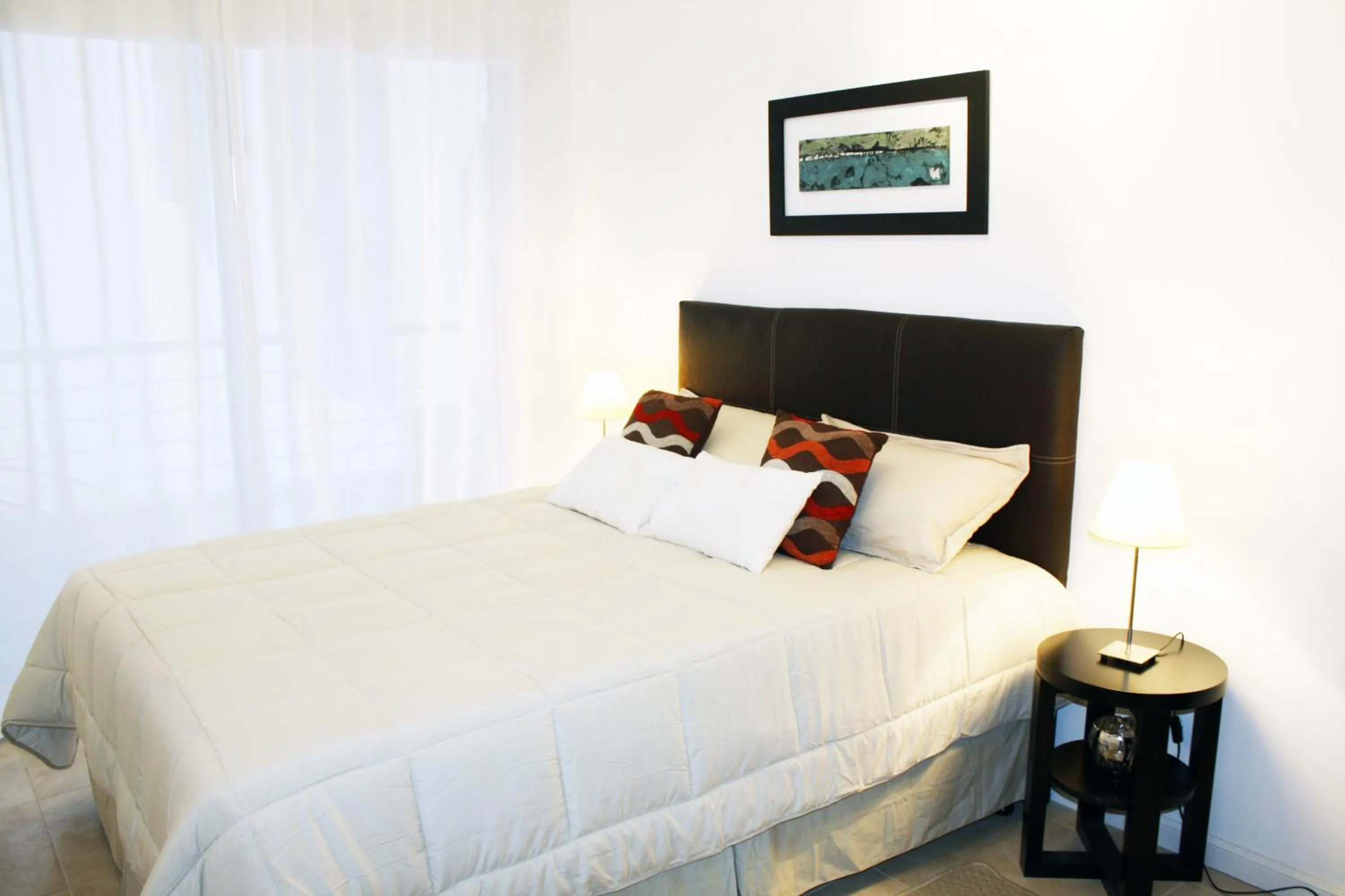 Bed in Arenales Suites
