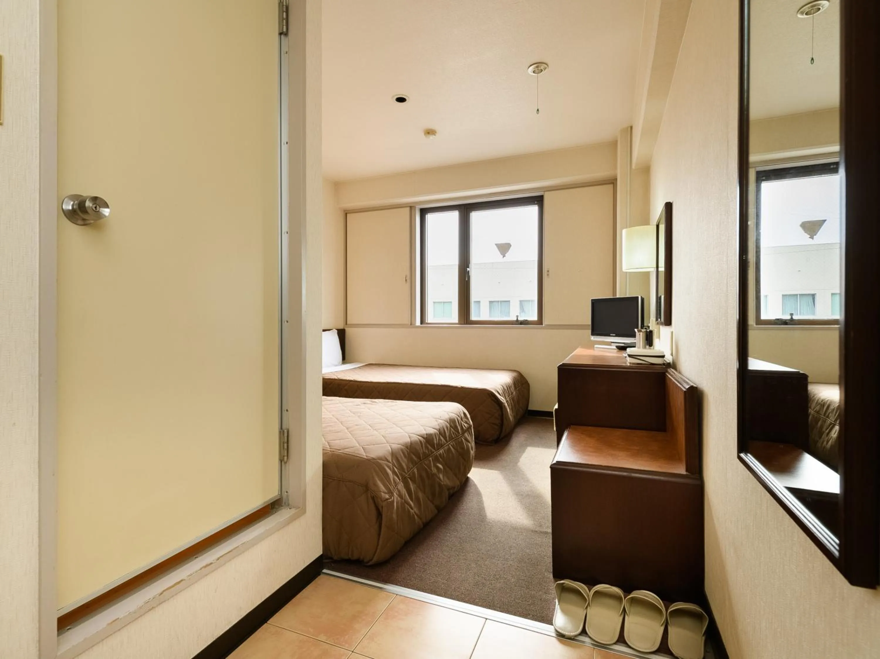 Bed in Tabist Kameyama Daiichi Hotel