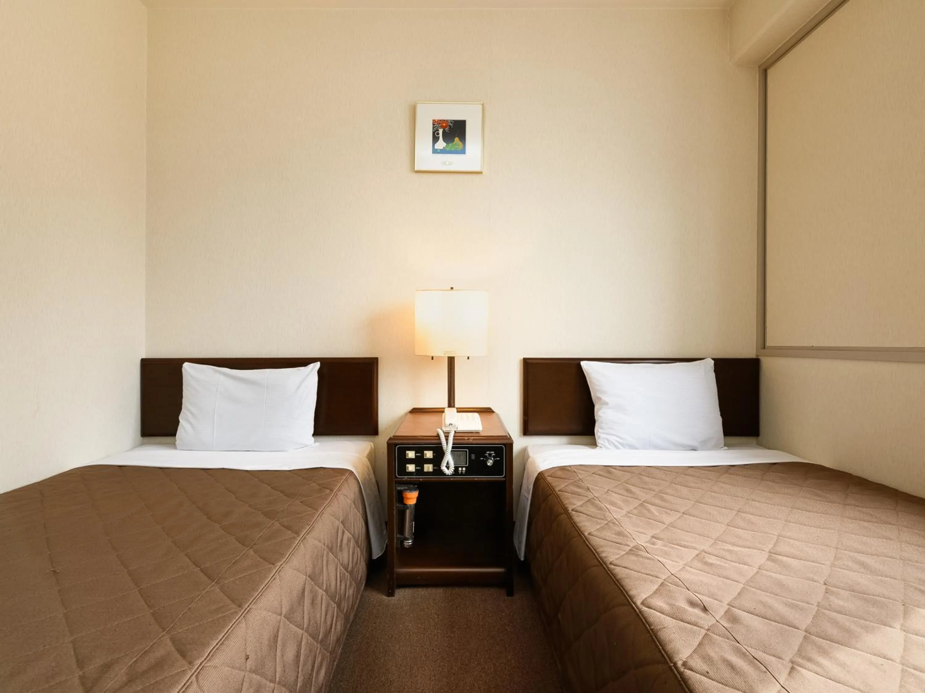 Bed in Tabist Kameyama Daiichi Hotel