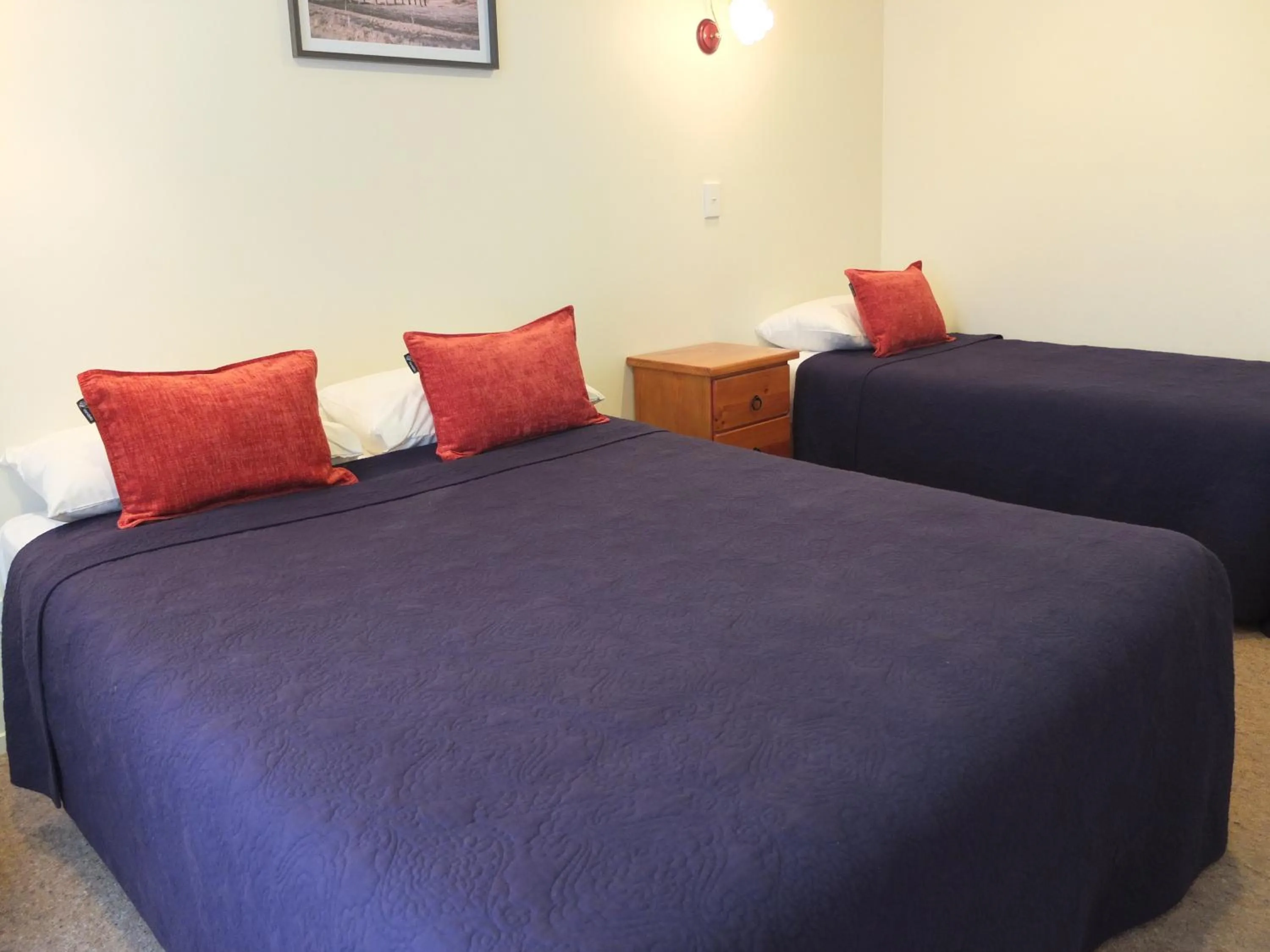 Bed in Colonial Court Motel