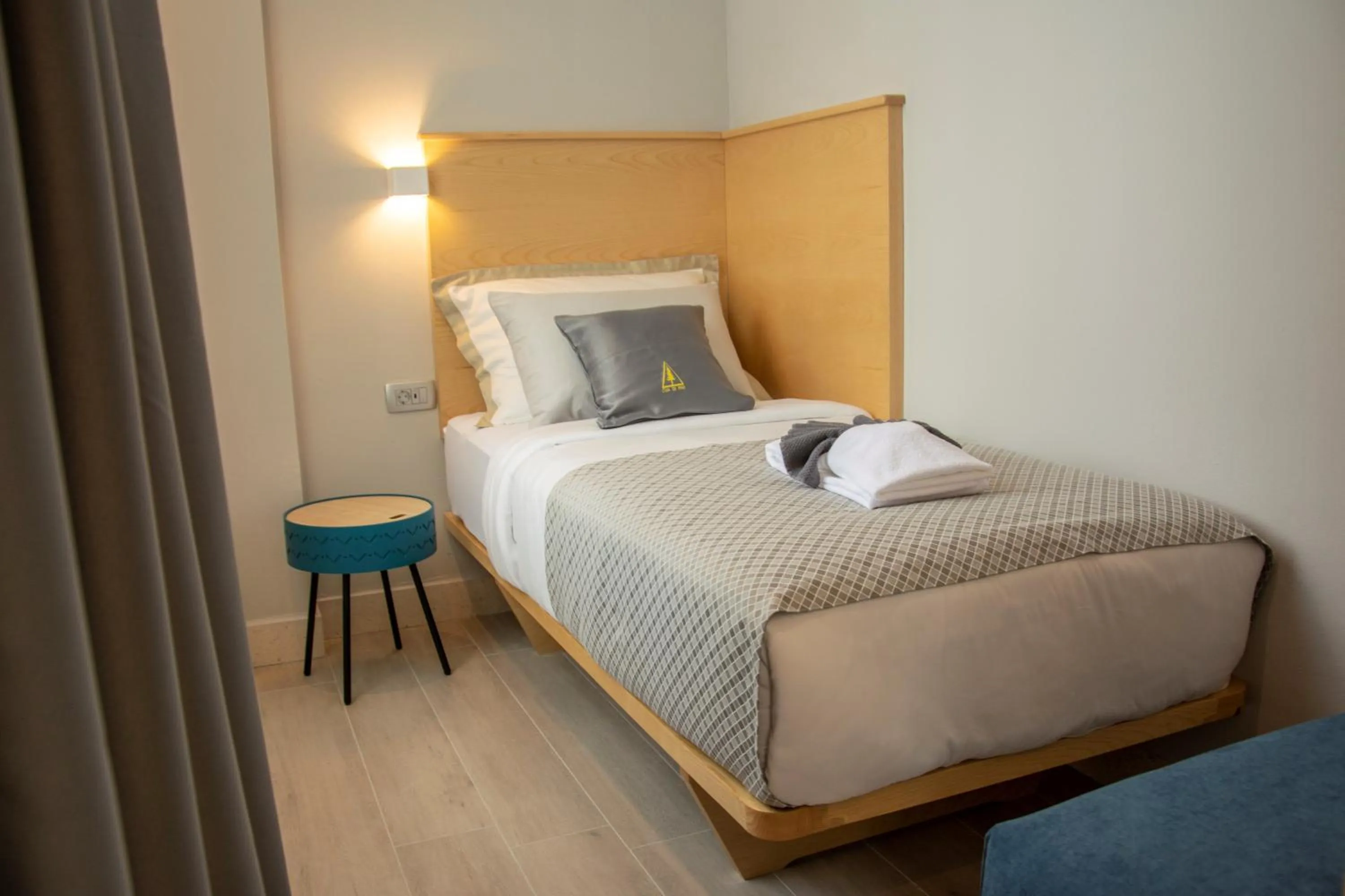 Bed in Casa di Pino EcoLodge Hotel