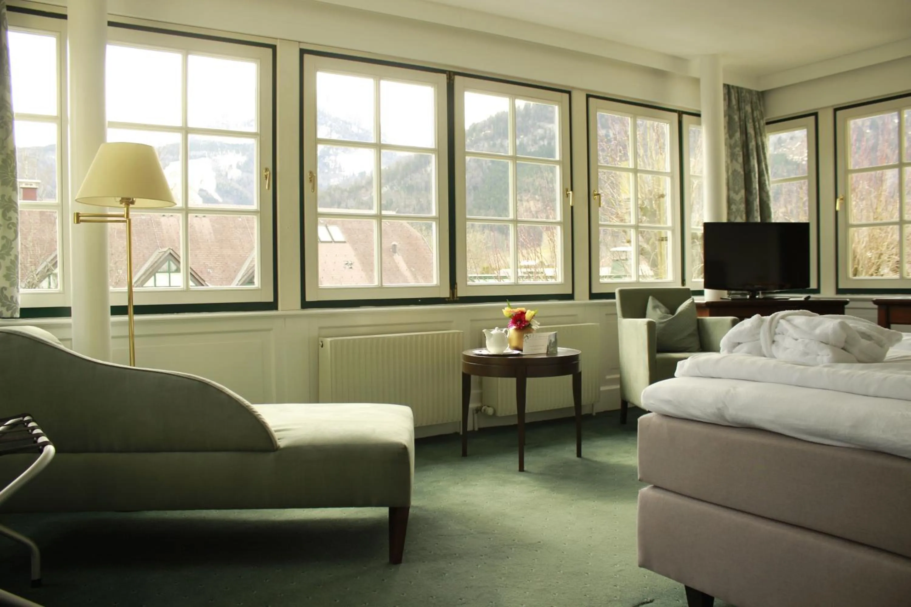 Seating area, Bed in Seehotel Brandauer's Villen