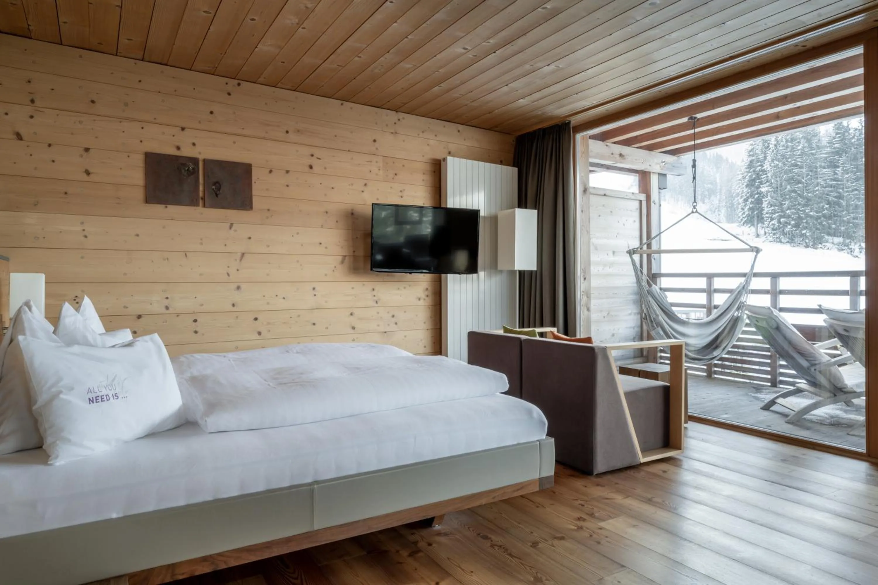 Photo of the whole room, Bed in Holzhotel Forsthofalm