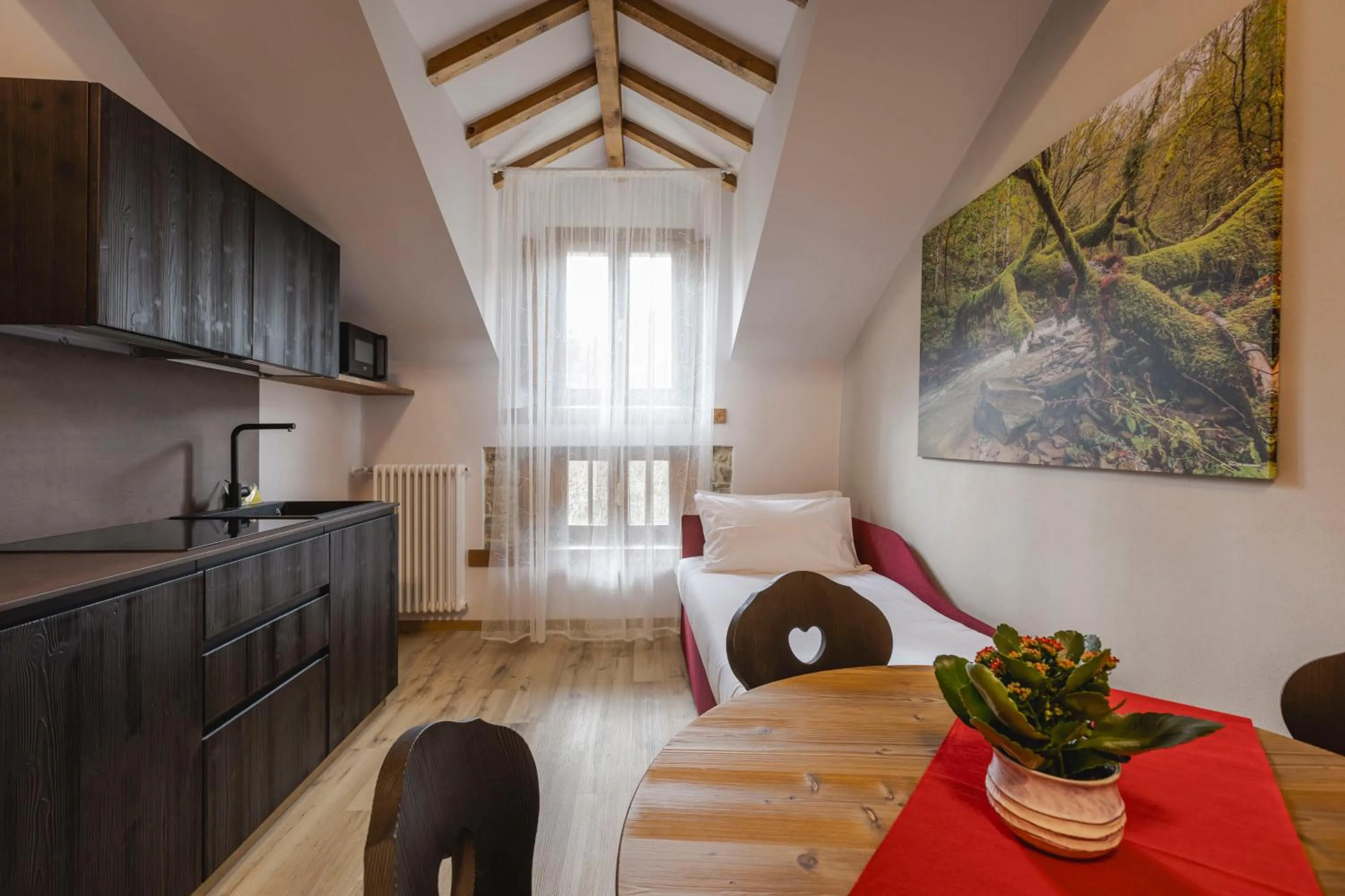 Kitchen or kitchenette, Bed in Granduca Mountain Wellness Apartments Campigna