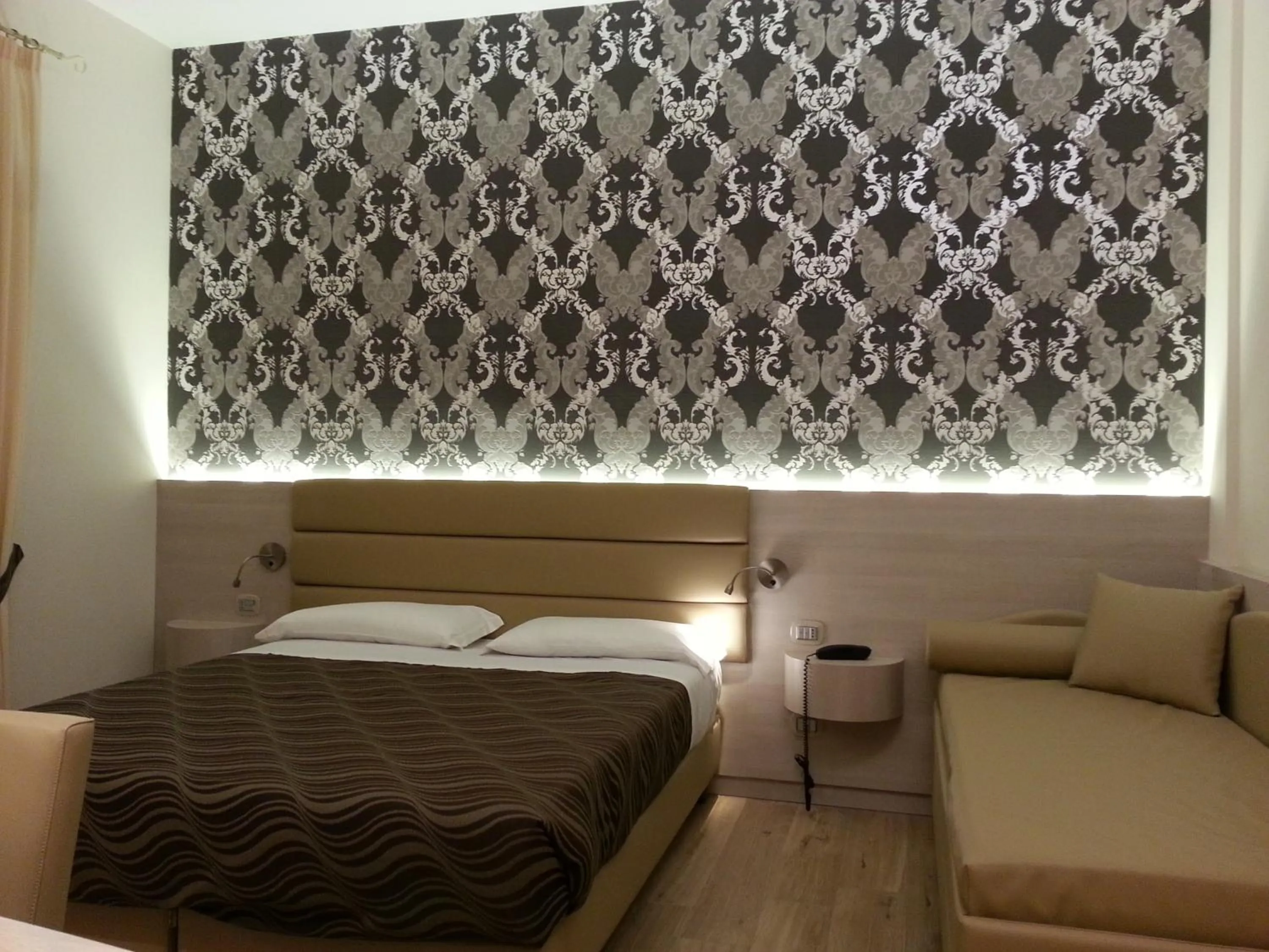 Decorative detail, Bed in Hotel Tre Torri