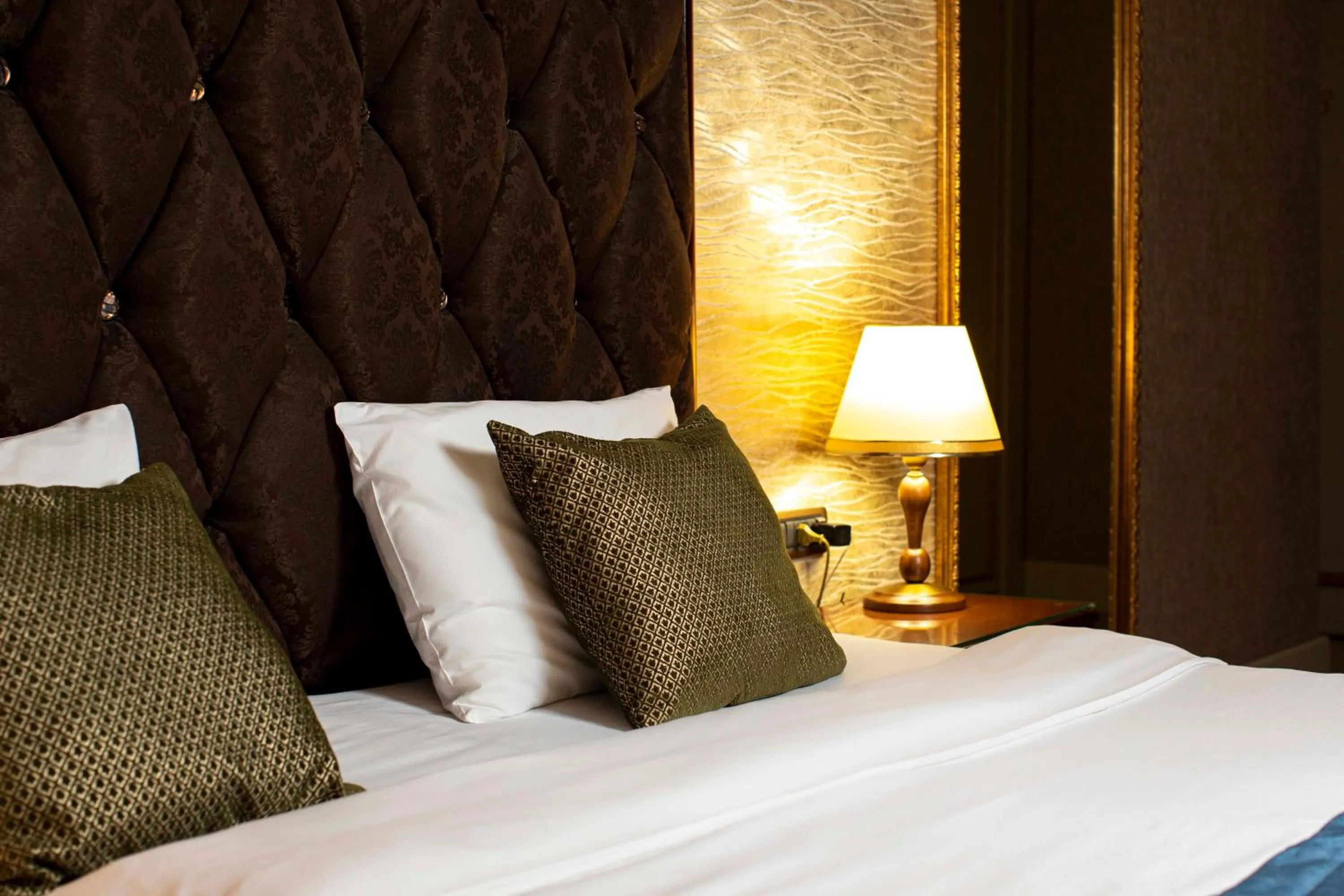 Bed in Sapphire Inn Hotel