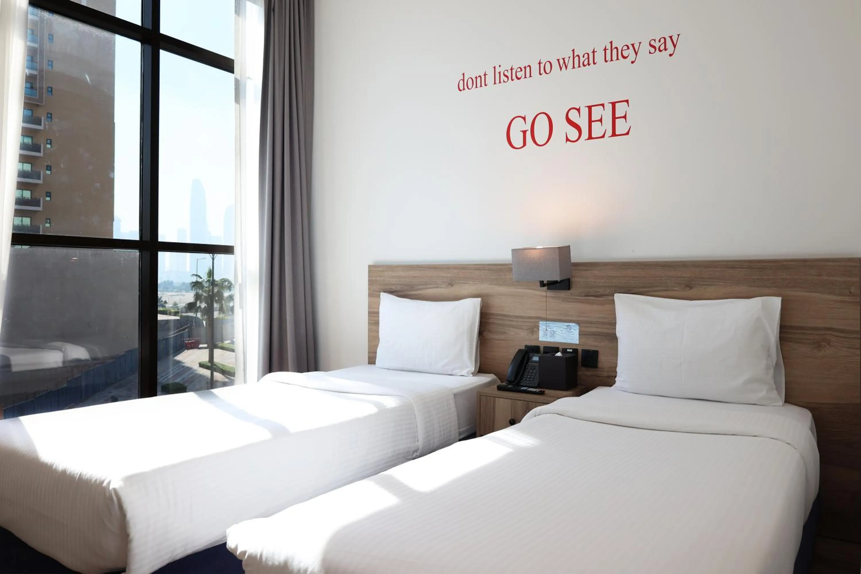 Bed in Kingsgate Al Jaddaf Hotel by Millennium