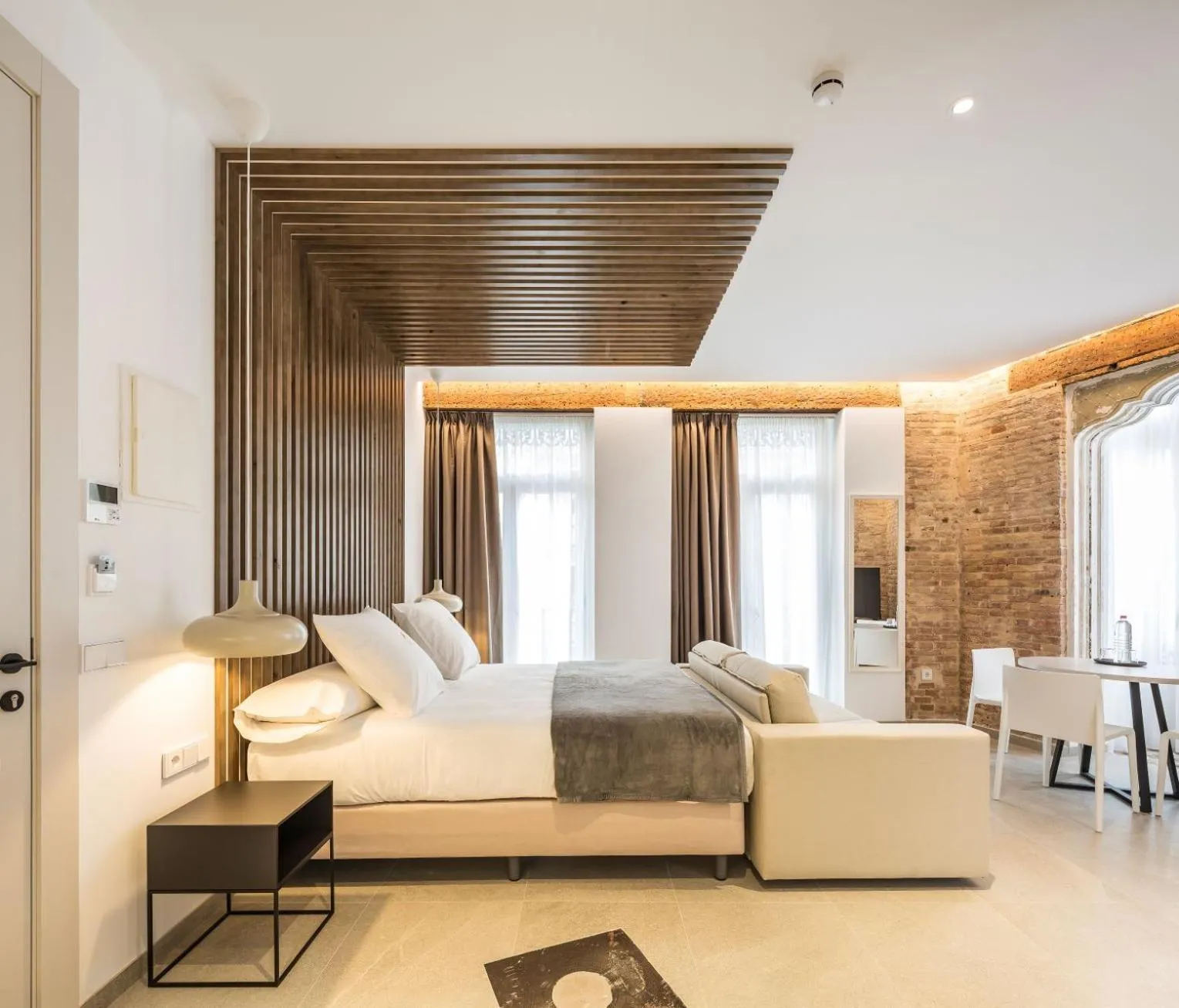 Bed in Mon Suites Benlliure