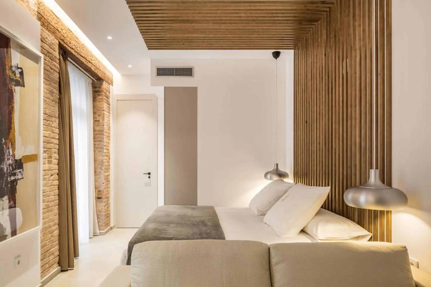 Bed in Mon Suites Benlliure