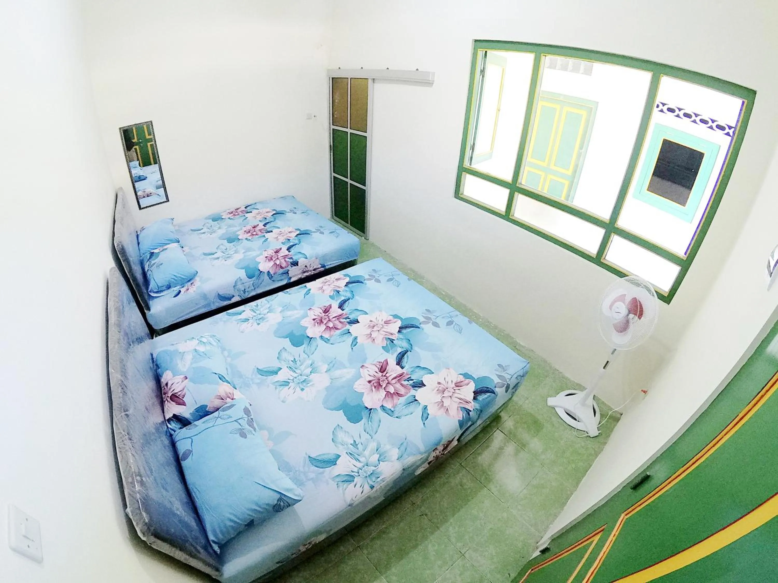 Bed in Ngadiwinatan Alleyway Guest House Jogja