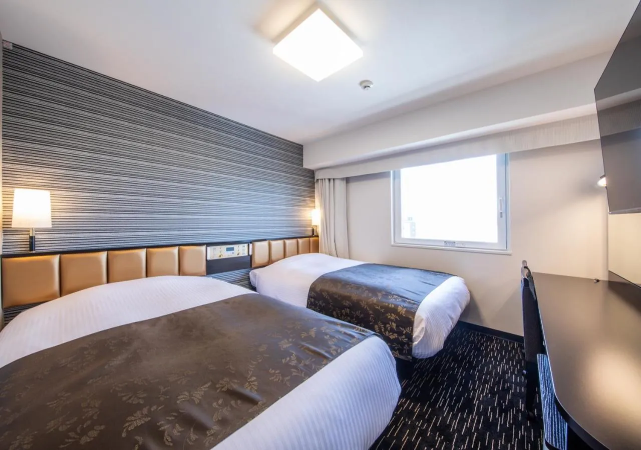 Photo of the whole room, Bed in APA Hotel Hakataeki Chikushiguchi