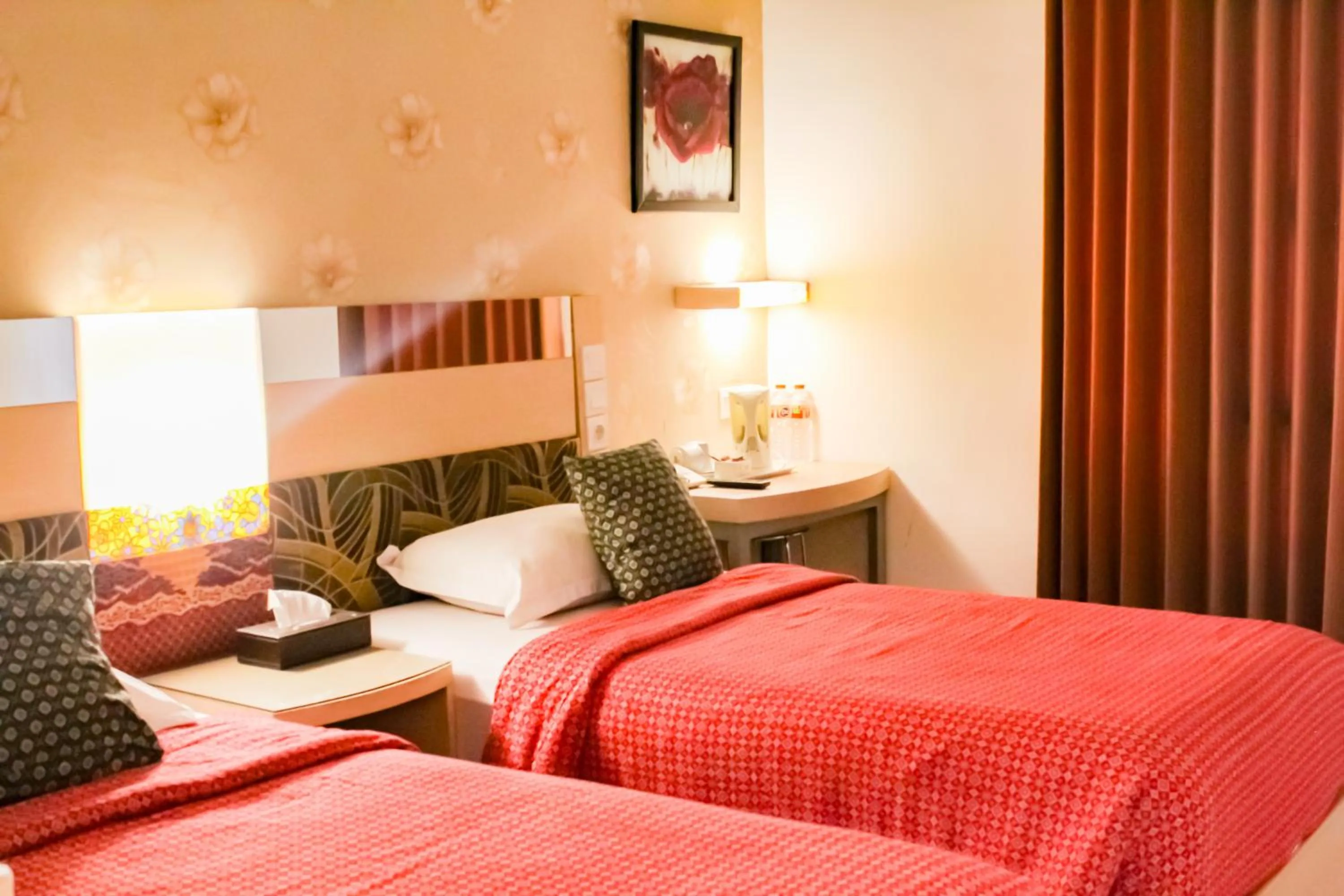 Bed in Hotel Dewarna Sutoyo Malang