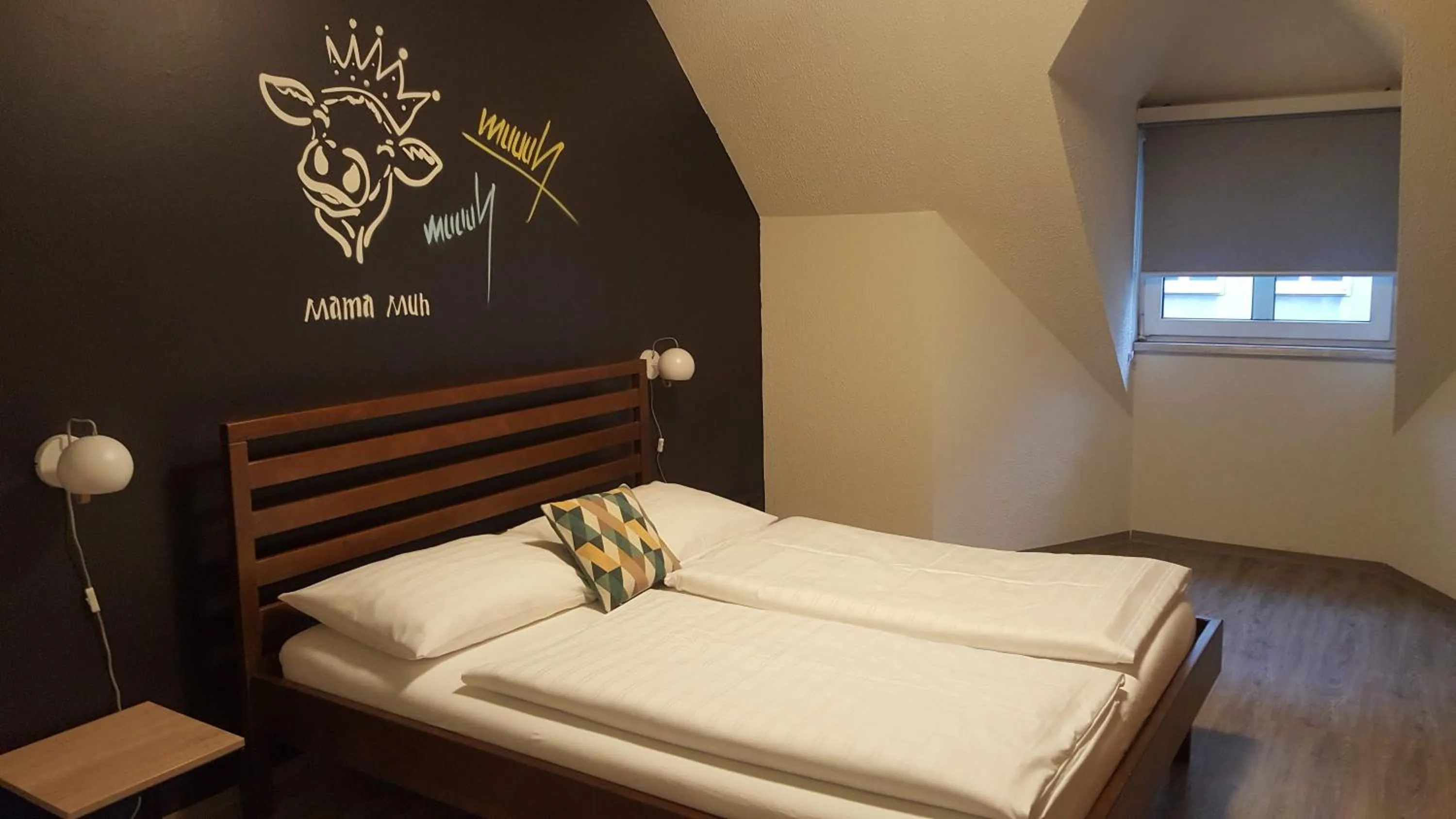 Photo of the whole room, Bed in Mama Muh Self-Check-in