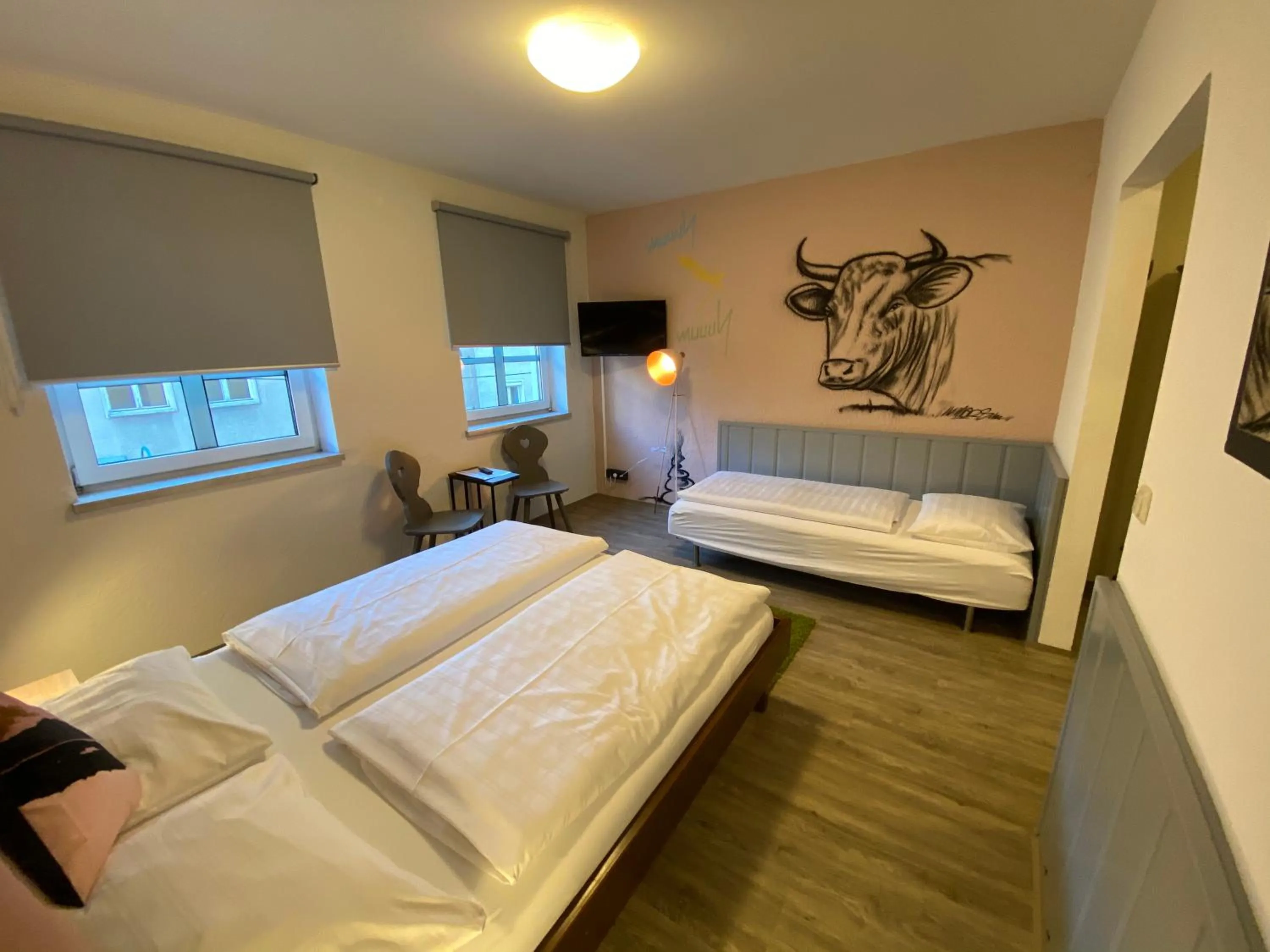 Photo of the whole room, Bed in Mama Muh Self-Check-in