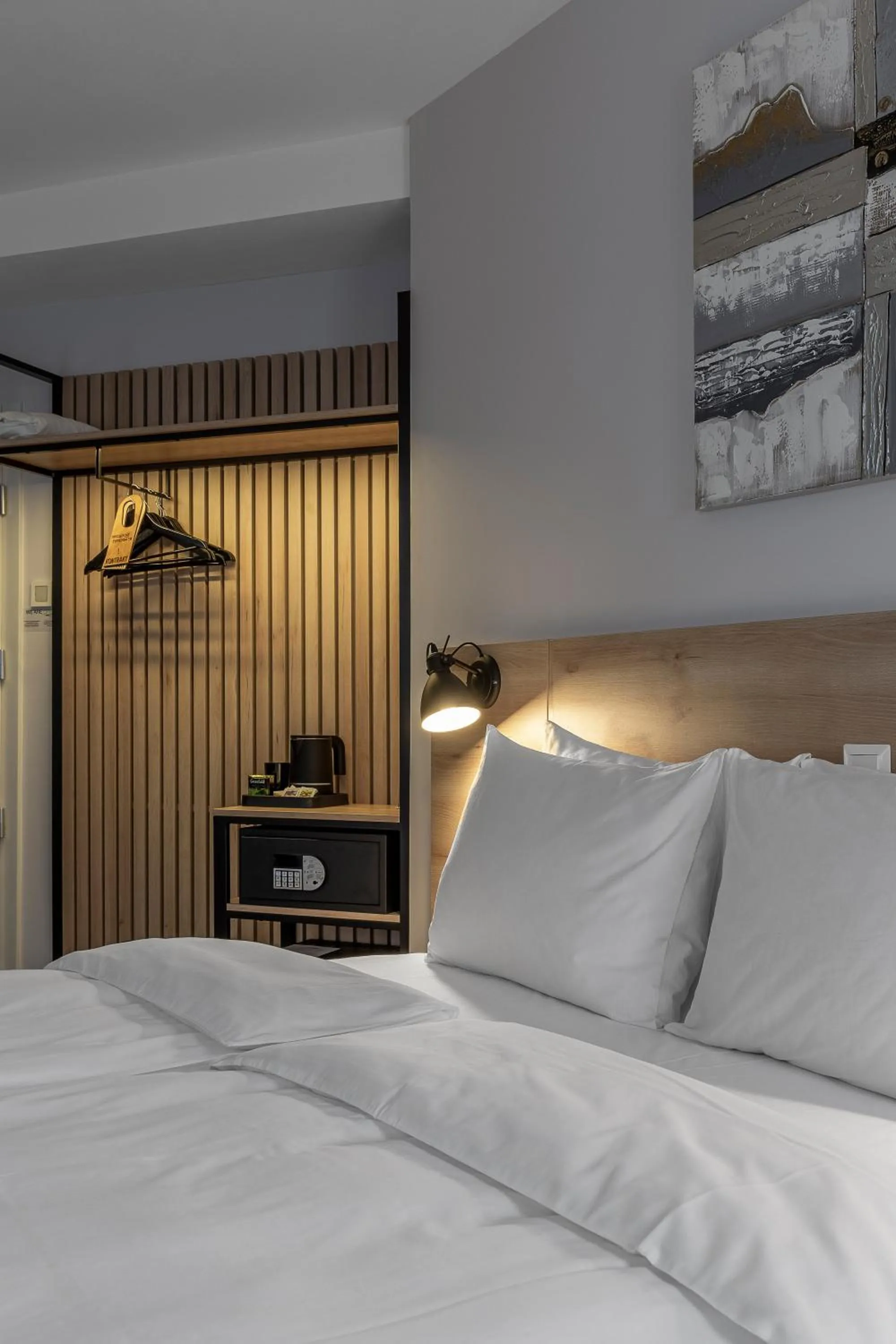 Bed in KONTRAKT Boutique Hotel