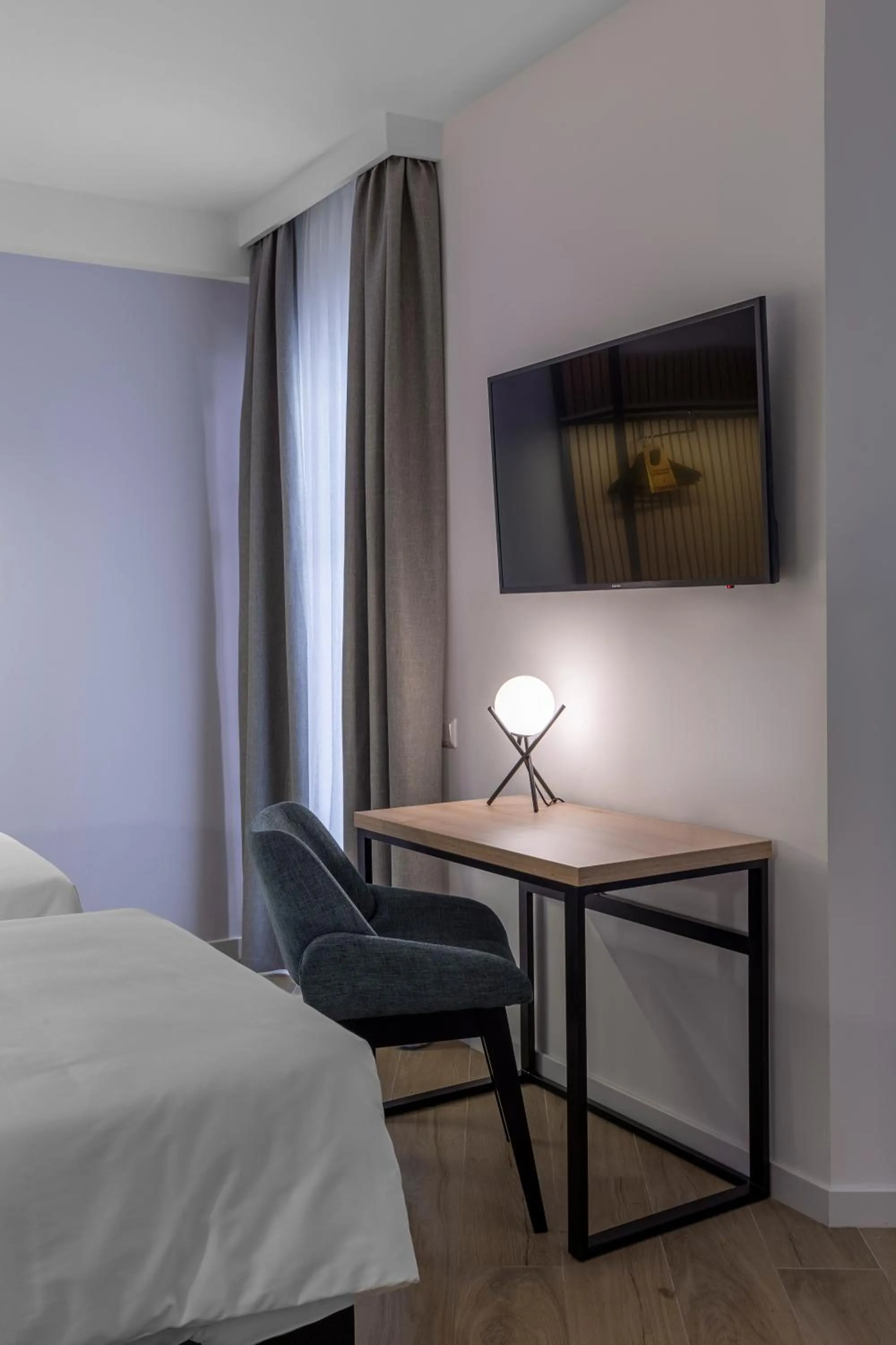 Bed in KONTRAKT Boutique Hotel