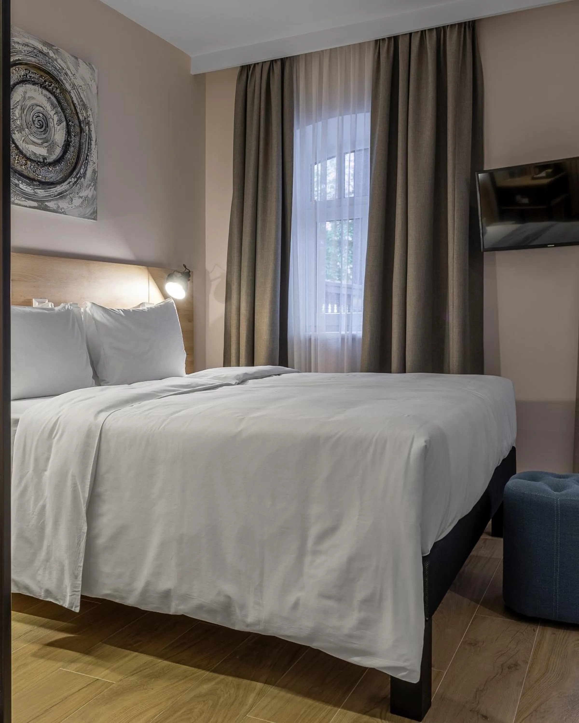 Bed in KONTRAKT Boutique Hotel