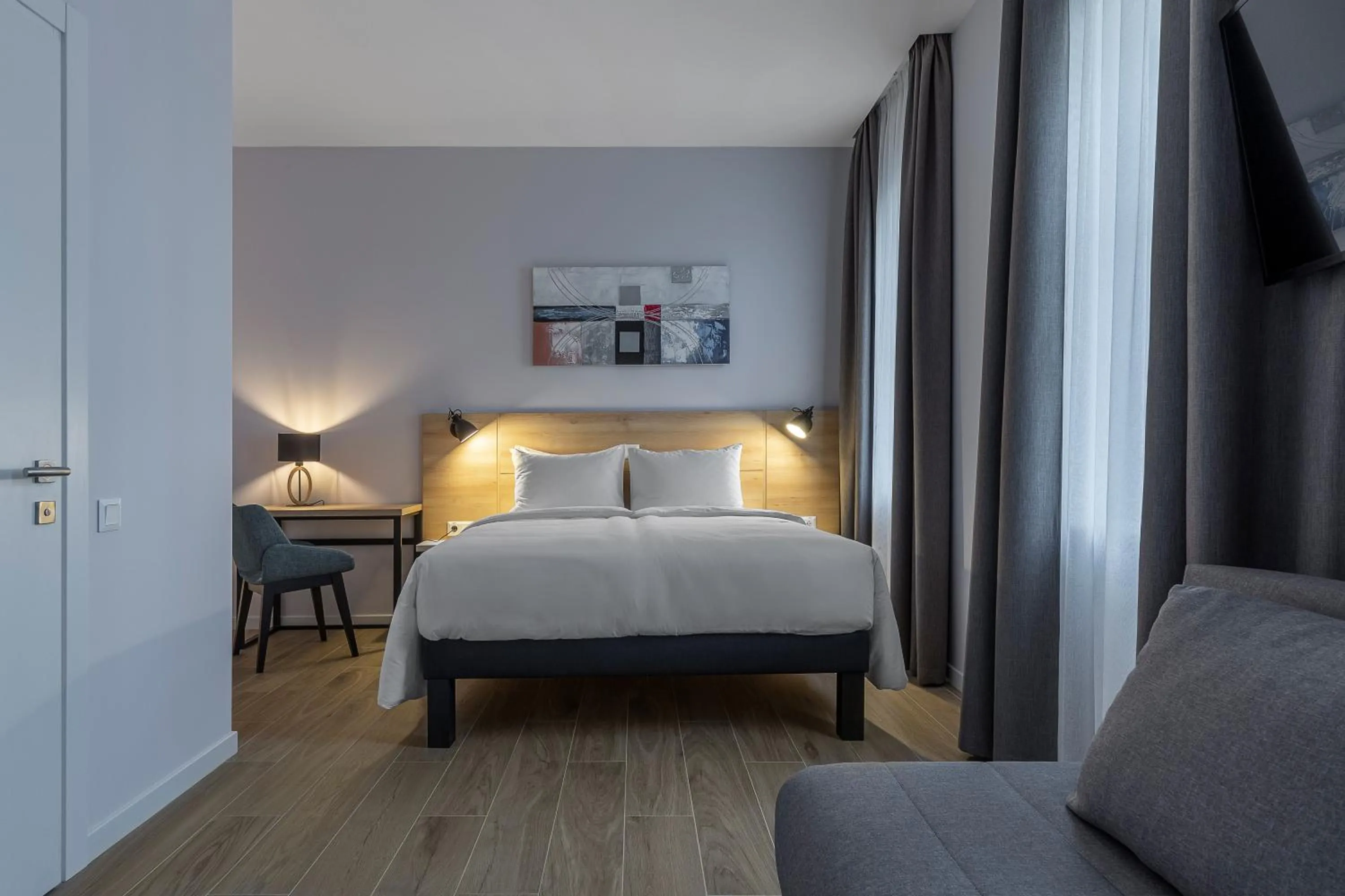 Bed in KONTRAKT Boutique Hotel