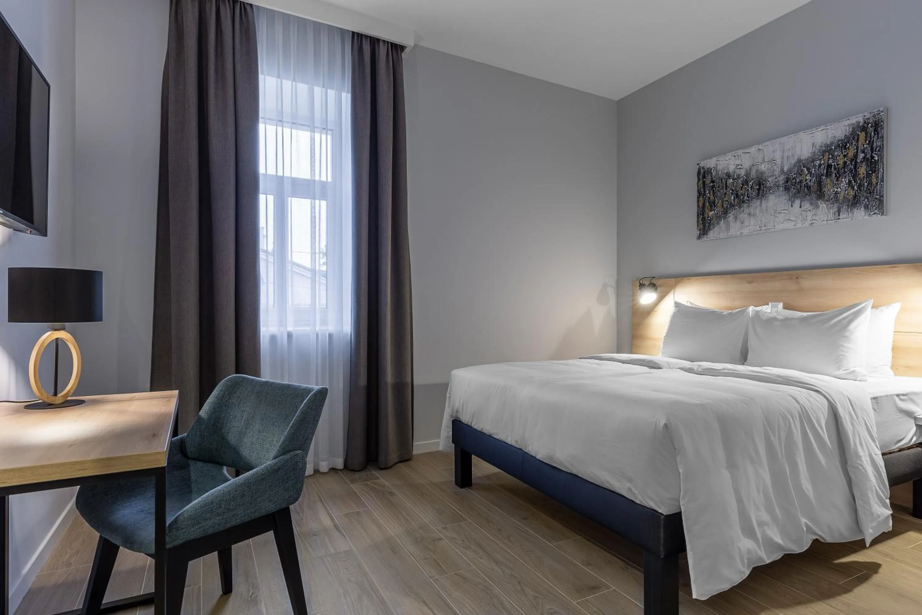 Bed in KONTRAKT Boutique Hotel