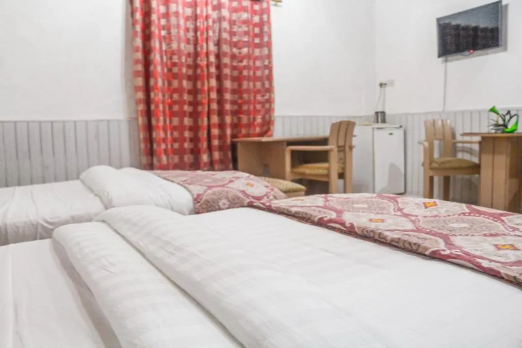 Bed in Hill View Hotel West Airport