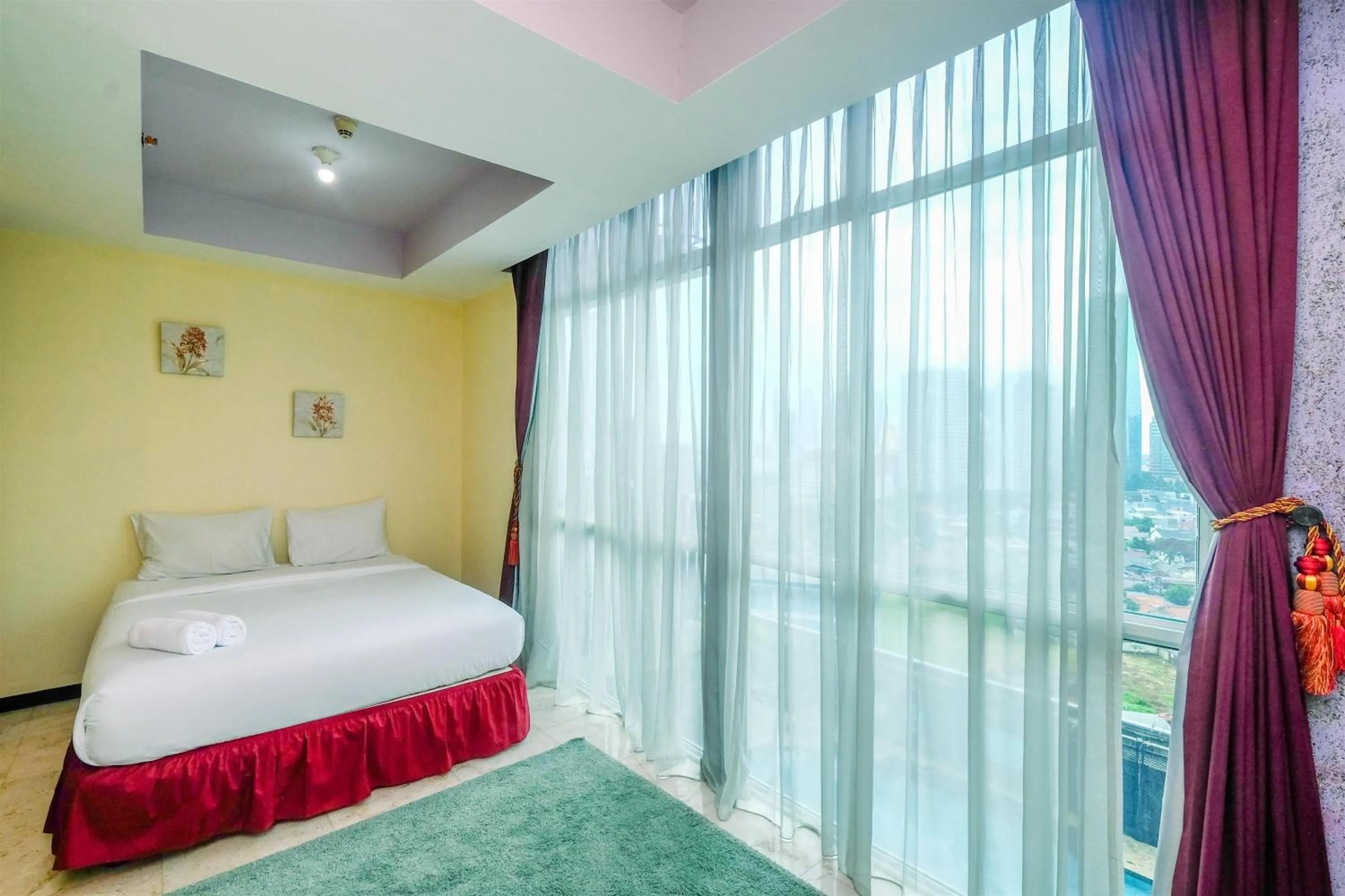 Bed in Exclusive with City View 3BR Apartment Bellagio Residence By Travelio