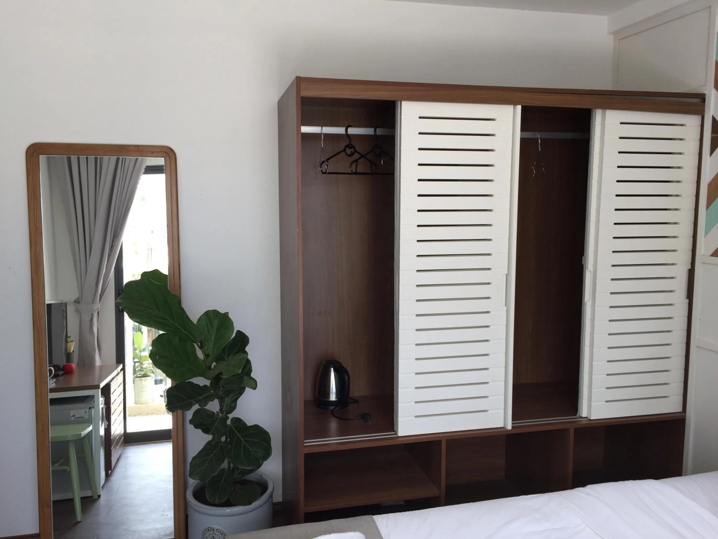 wardrobe in The Scent Boutique Dalat Hotel