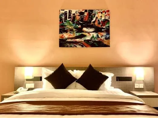 Bed in KLUANG RIVERVIEW HOTEL