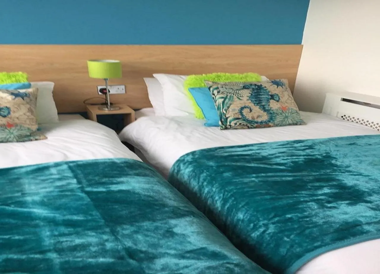 Bed in The Beaucliffe Hotel