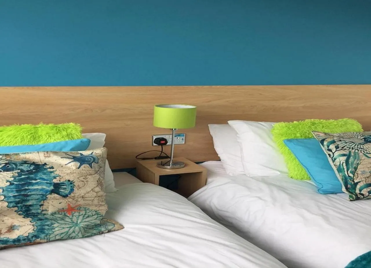 Bed in The Beaucliffe Hotel