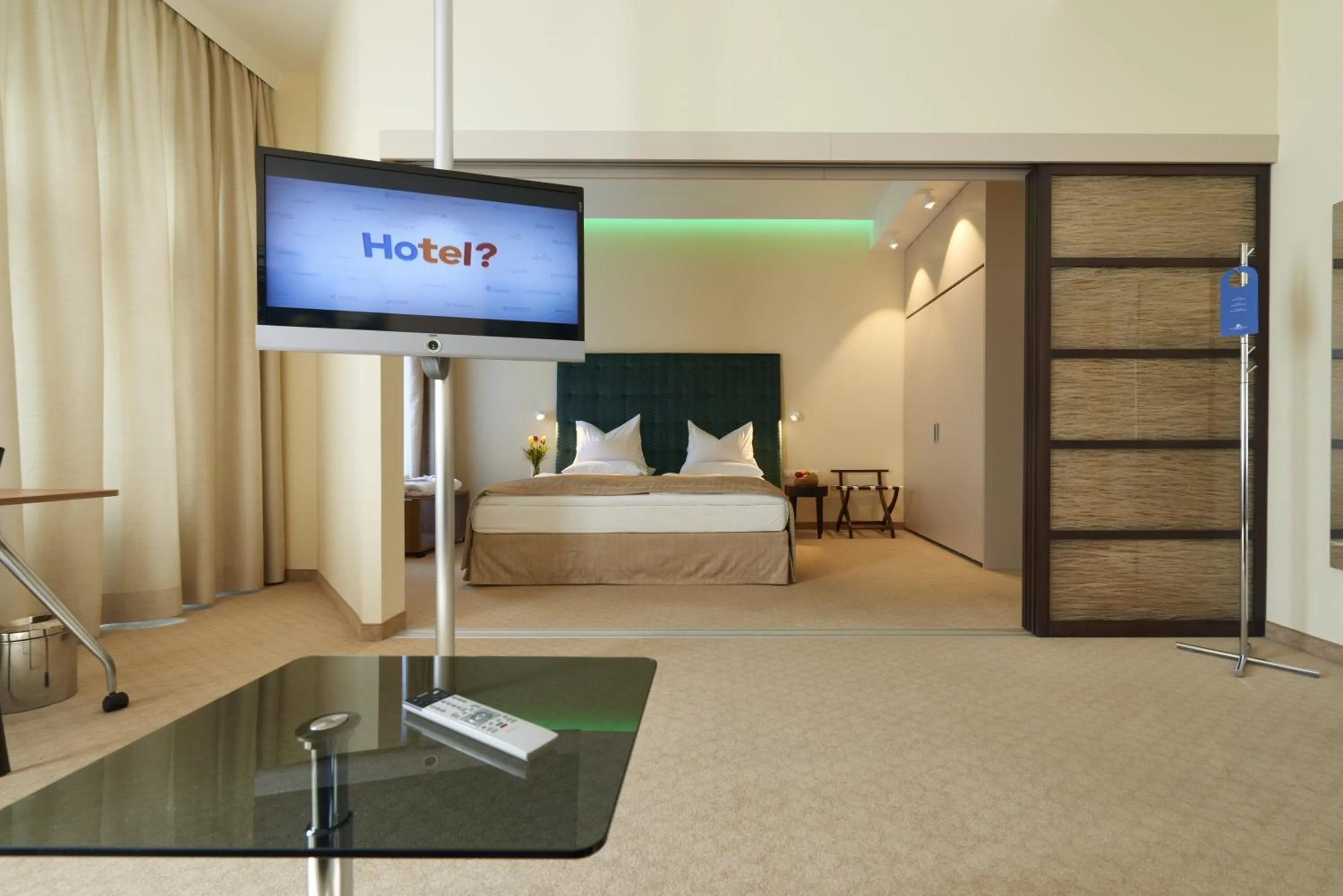 Bed in HiLight Suites Hotel