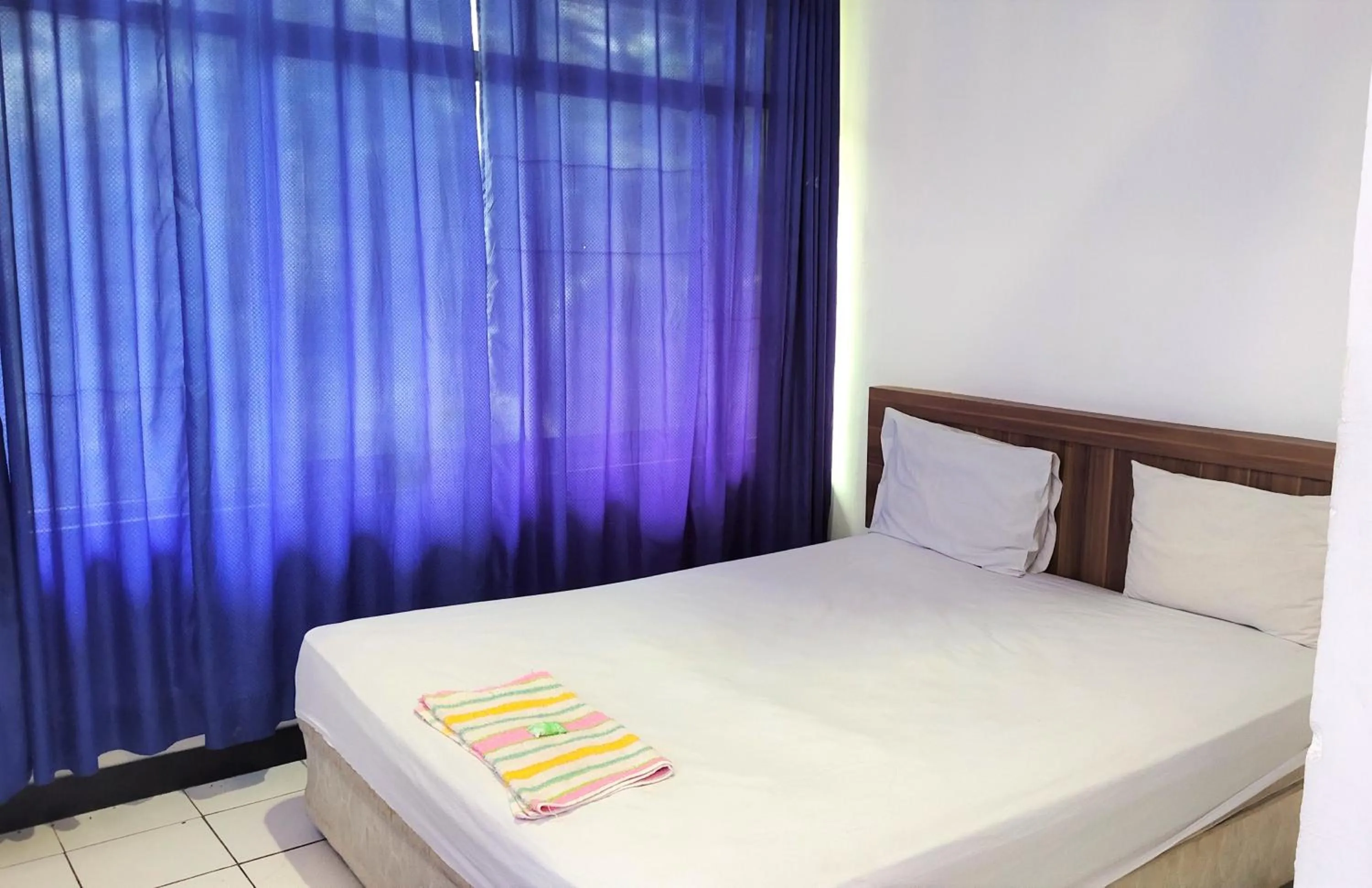 Bedroom in De' Premium Hotel Musi Raya