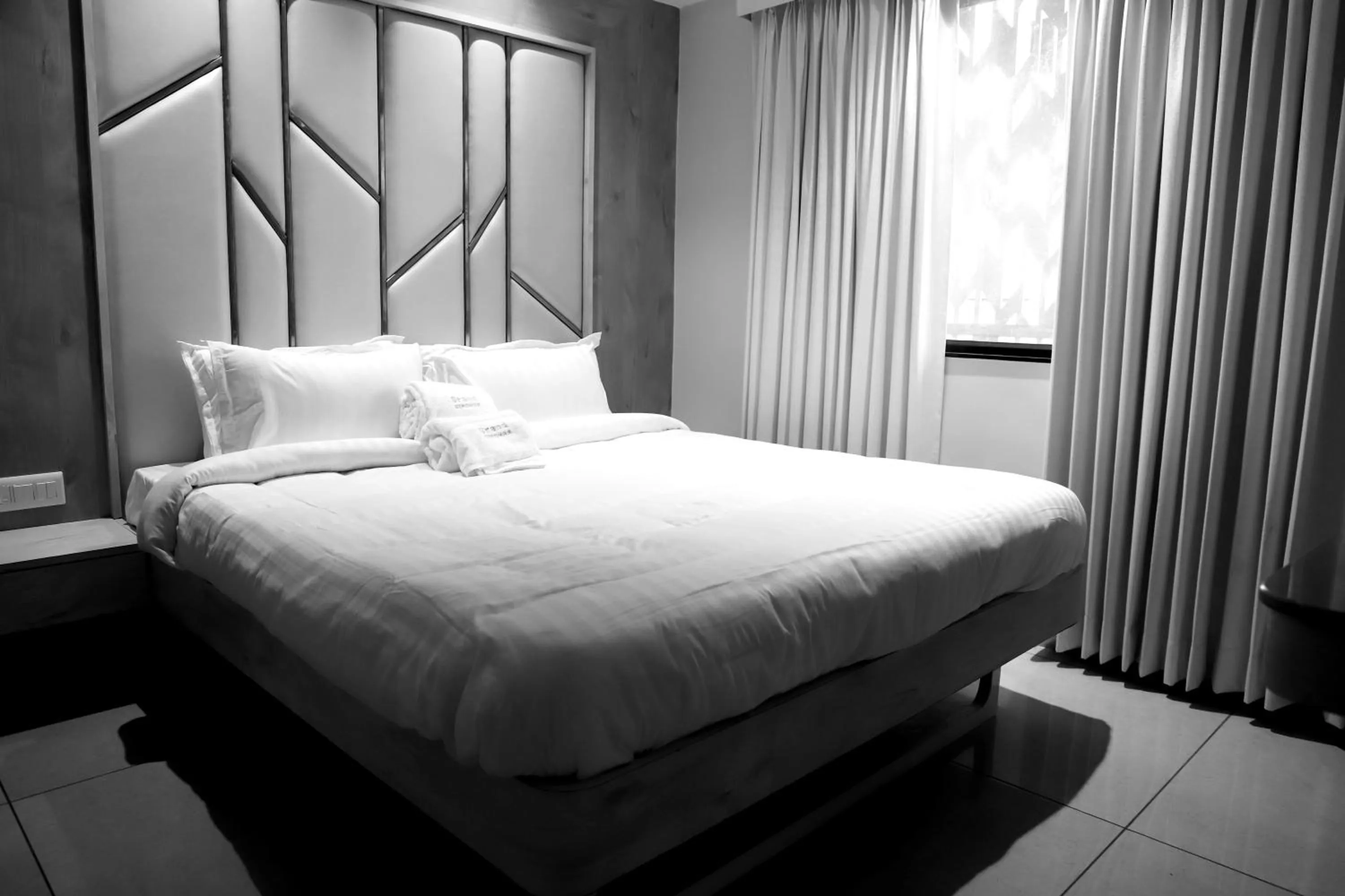 Bed in Hotel Grand Girdhar