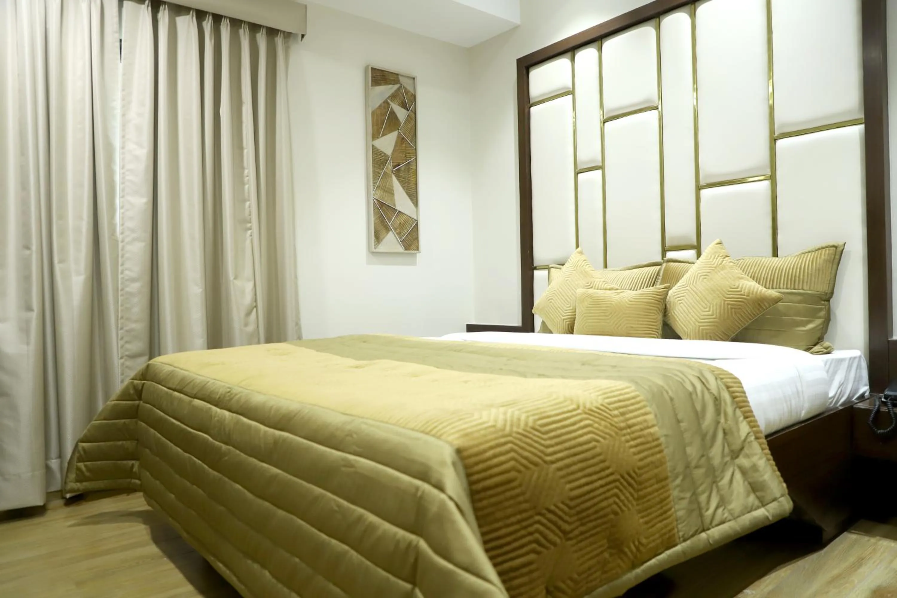 Bed in Hotel Grand Girdhar