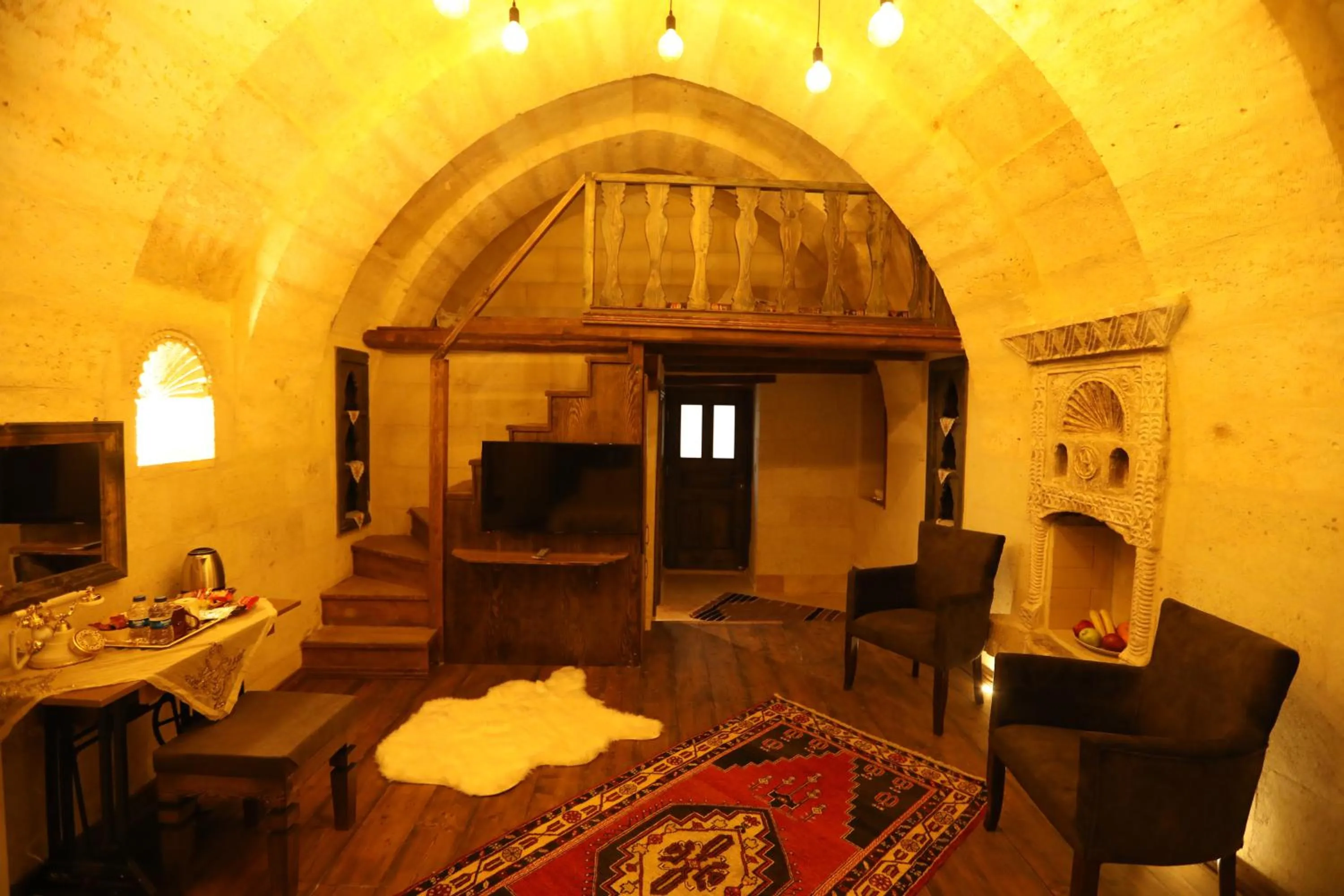 Seating area, Bed in Hancı Cave Hotel