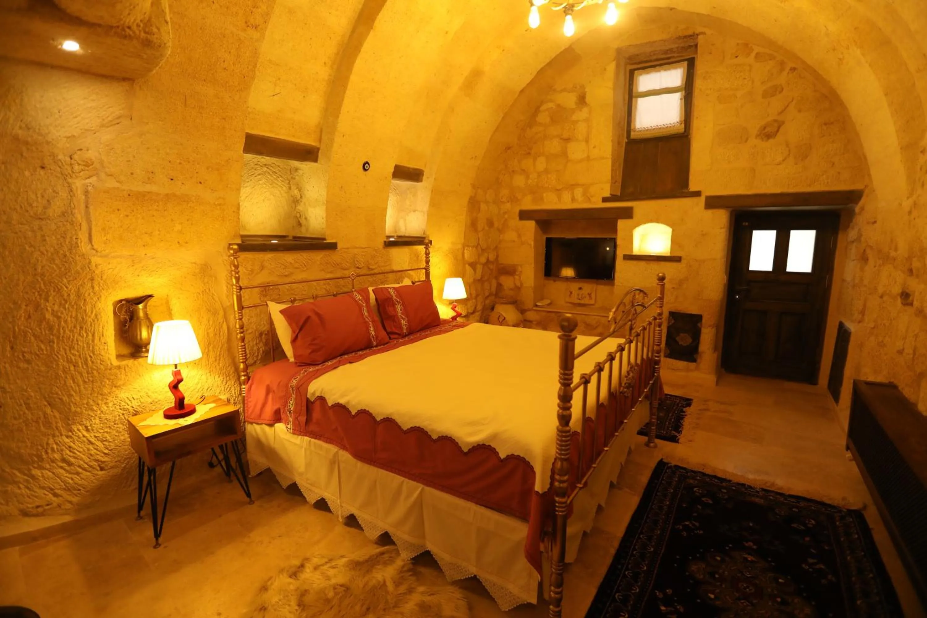 Bed in Hancı Cave Hotel