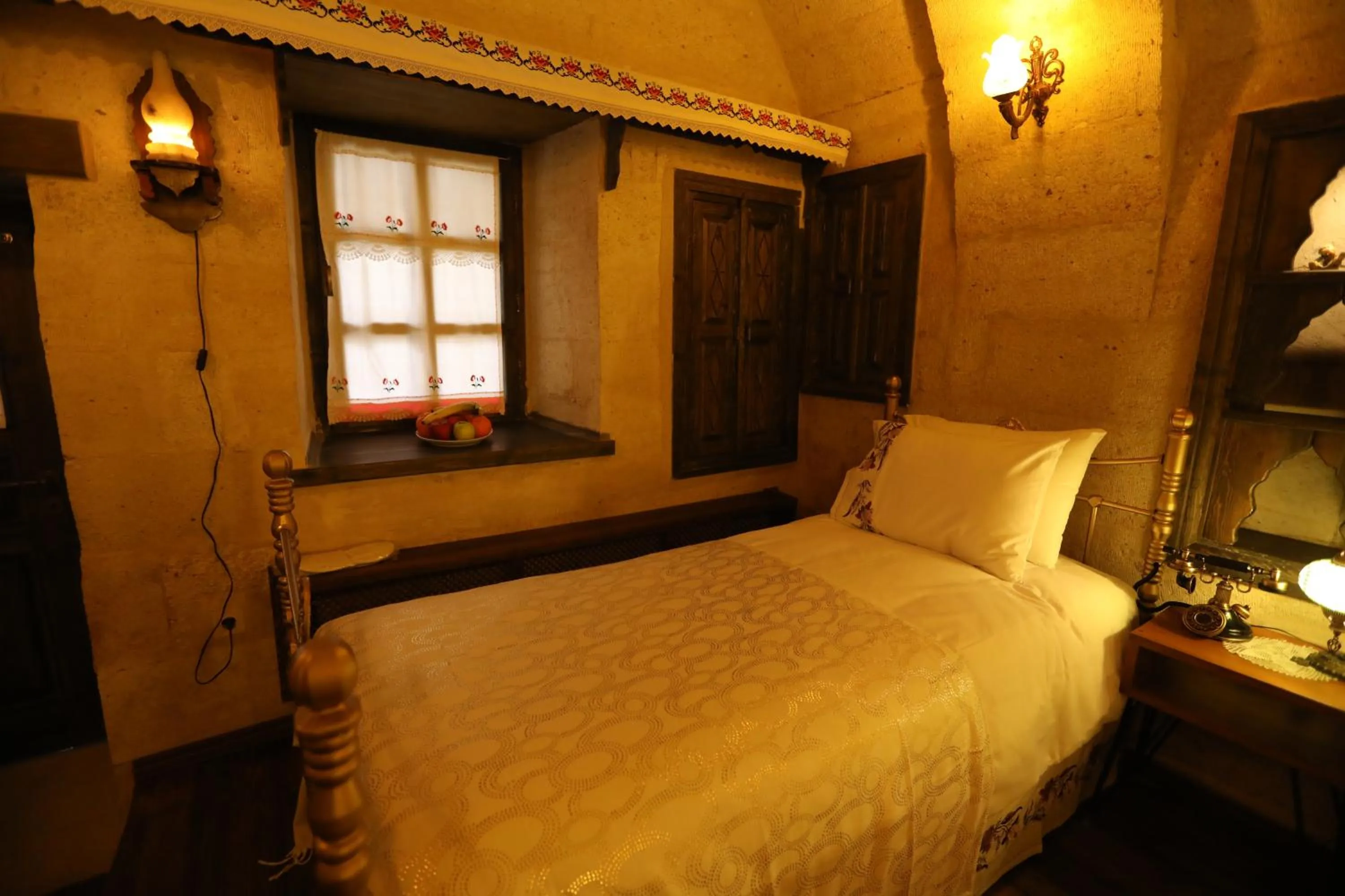 Bed in Hancı Cave Hotel