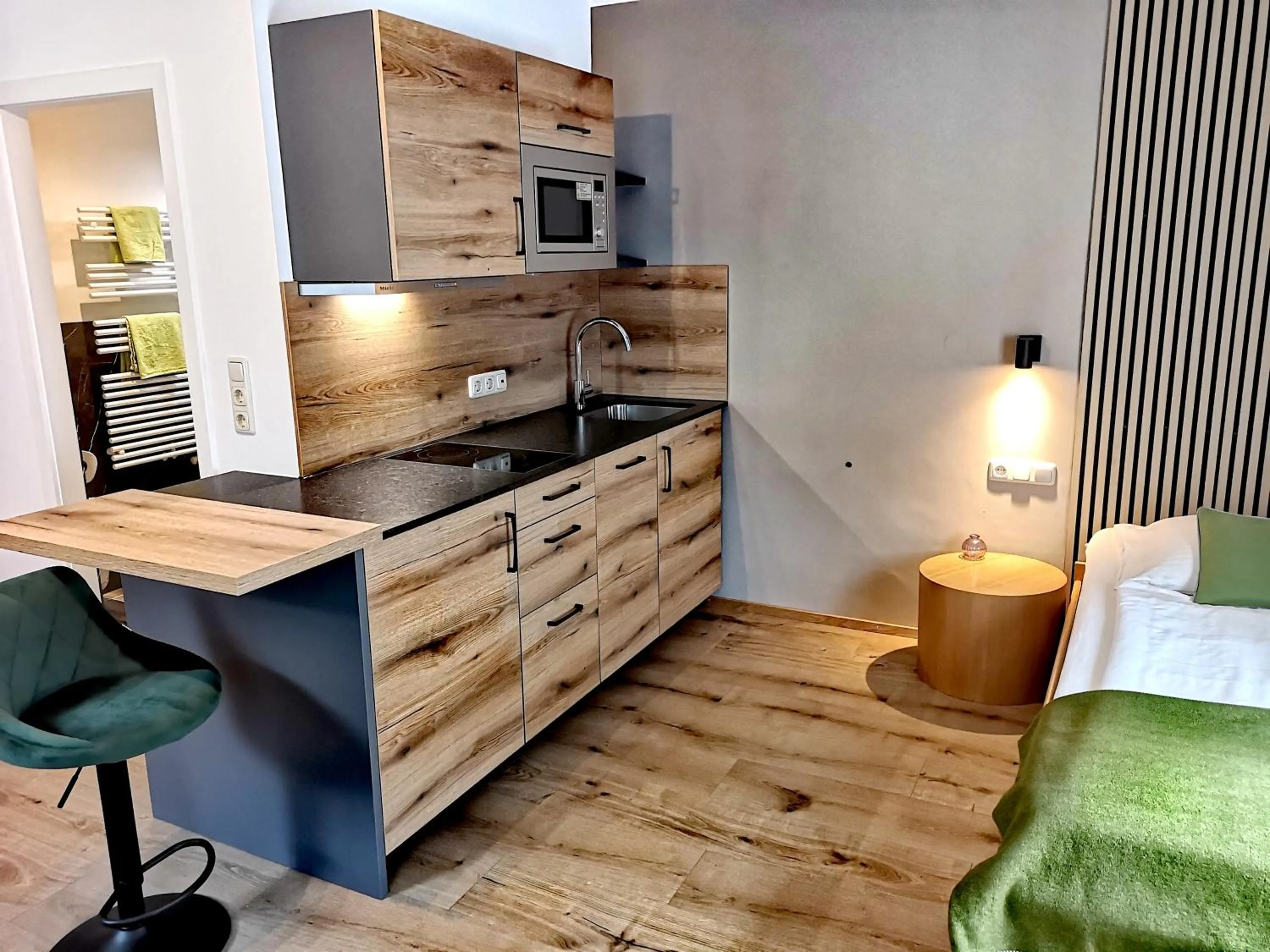 Kitchen or kitchenette, Bed in Hotel Apartment Das Au- Gut