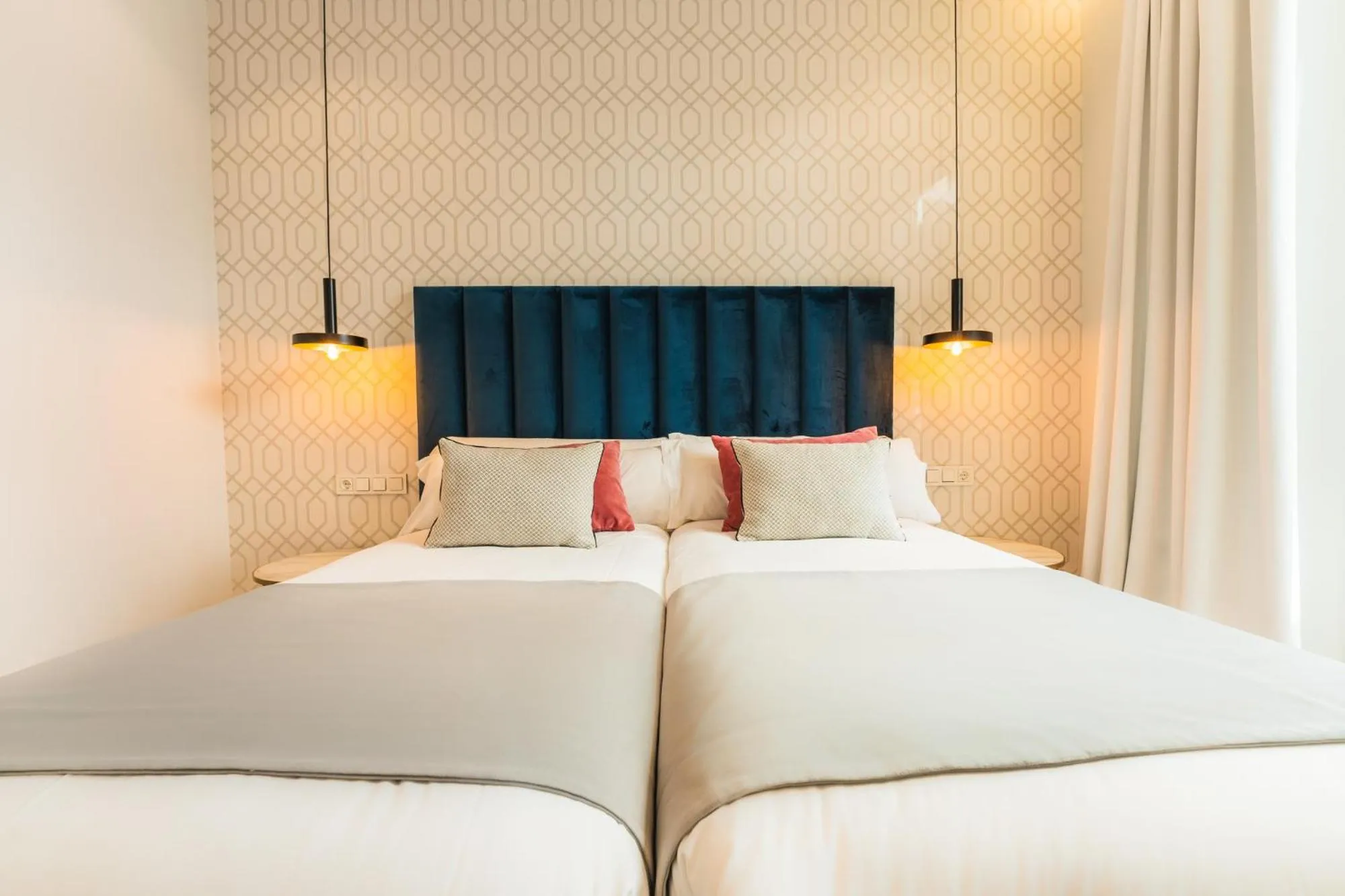 Bed in Debambú Suites