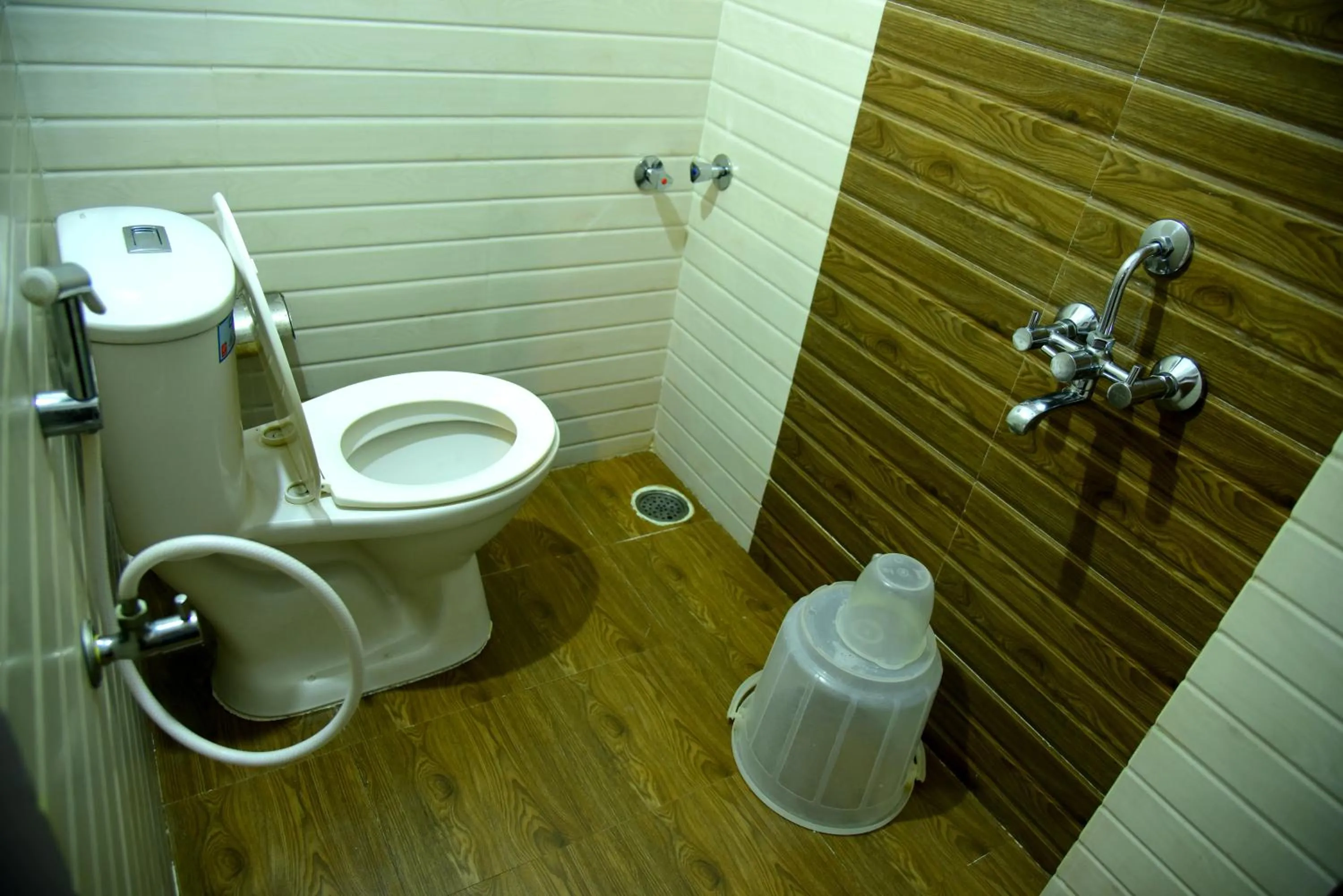 Toilet in Hotel Housefinch Residency