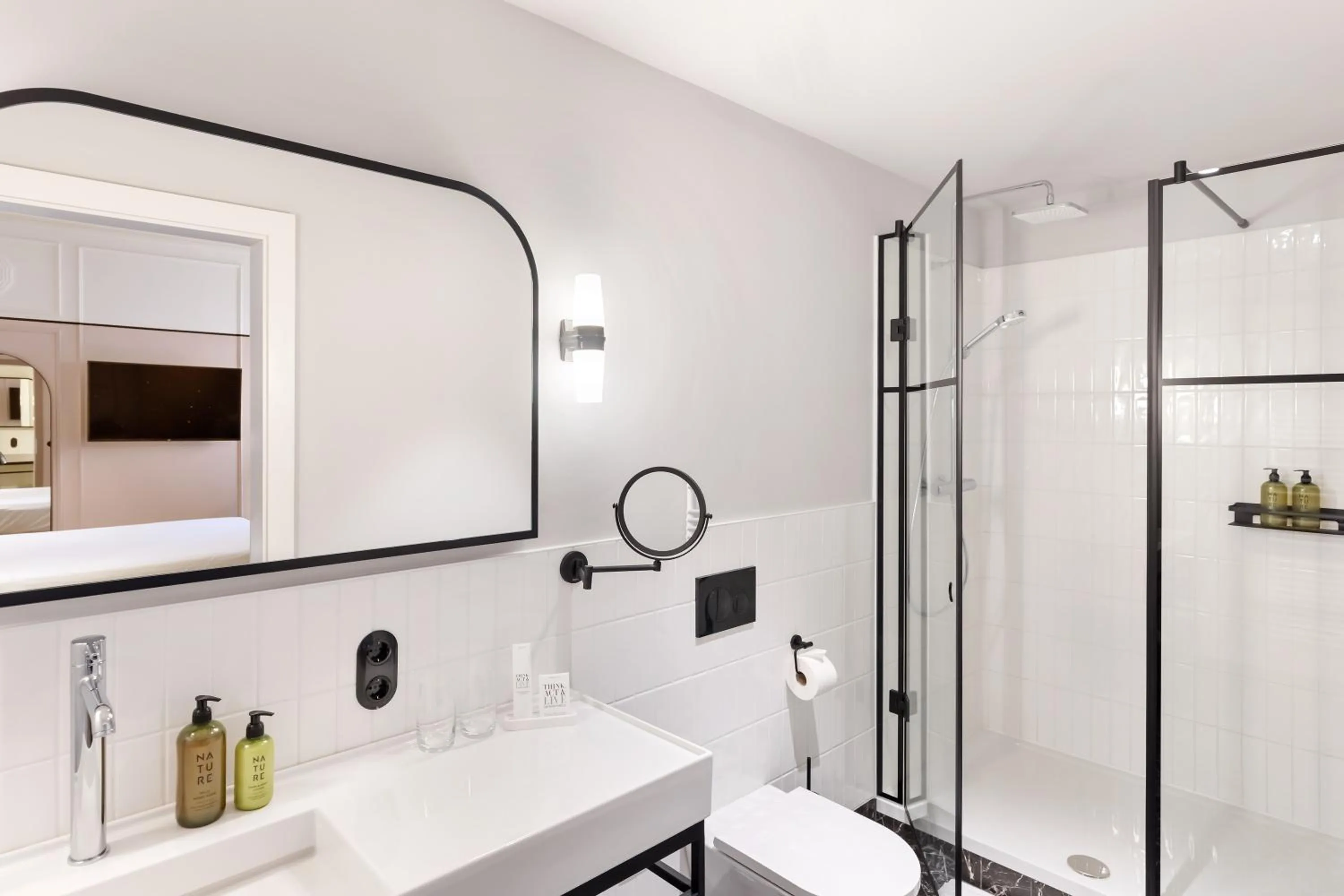 Bathroom in Hotel Astoria Vienna, Curio Collection by Hilton