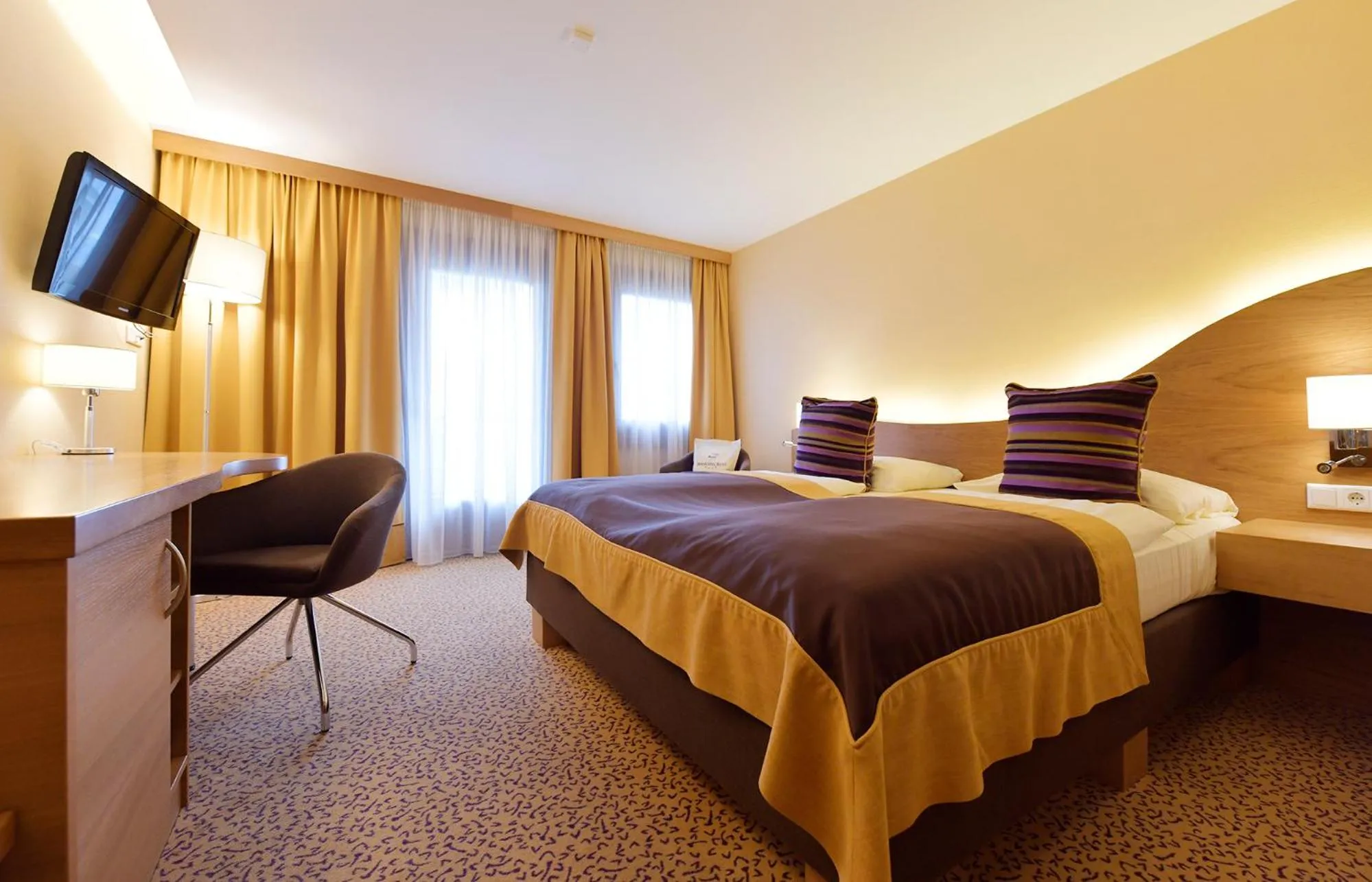 Photo of the whole room, Bed in Seehotel Rust