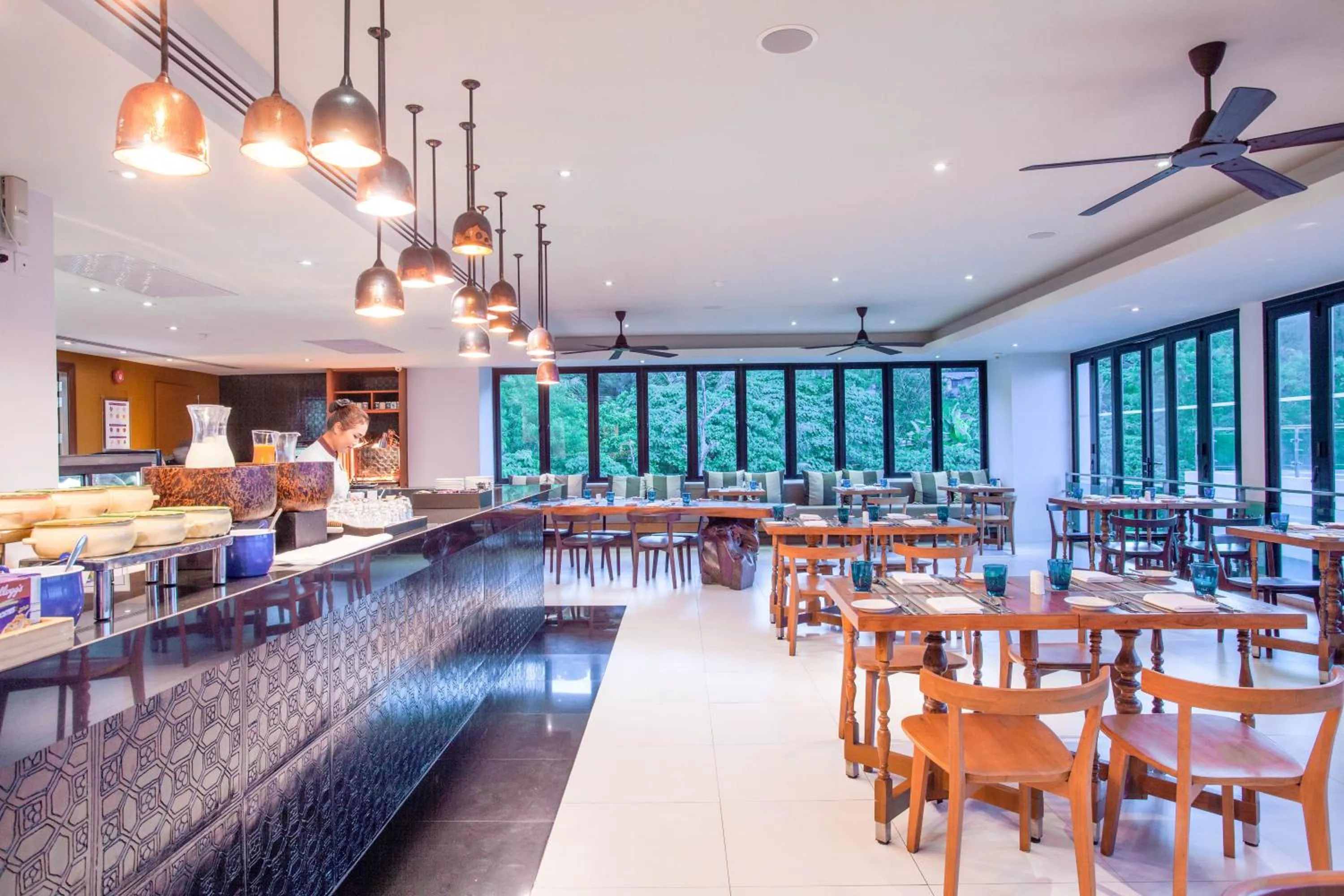 Dining area in Zenmaya Oceanfront Phuket, Trademark Collection by Wyndham