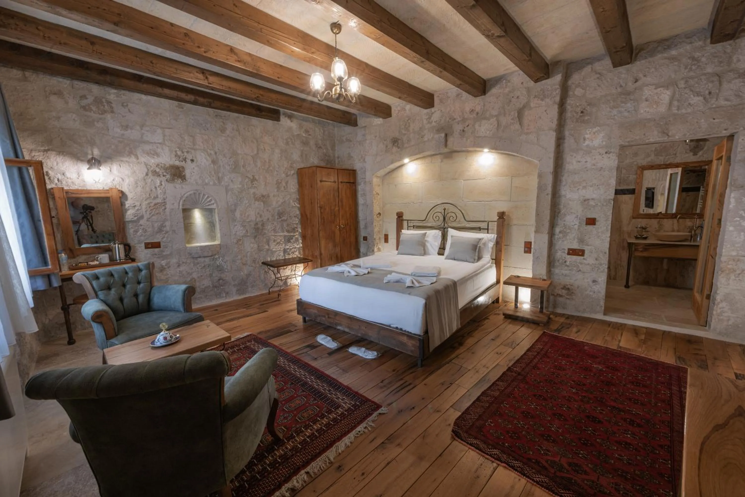 Bed in Sarnich Cave Suites