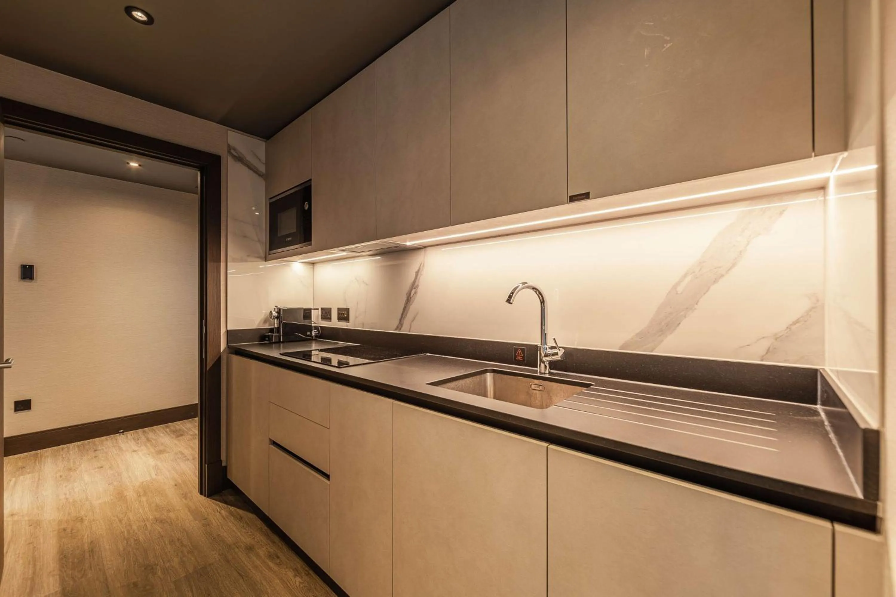 Kitchen or kitchenette in The Fellows House Cambridge, Curio Collection By Hilton