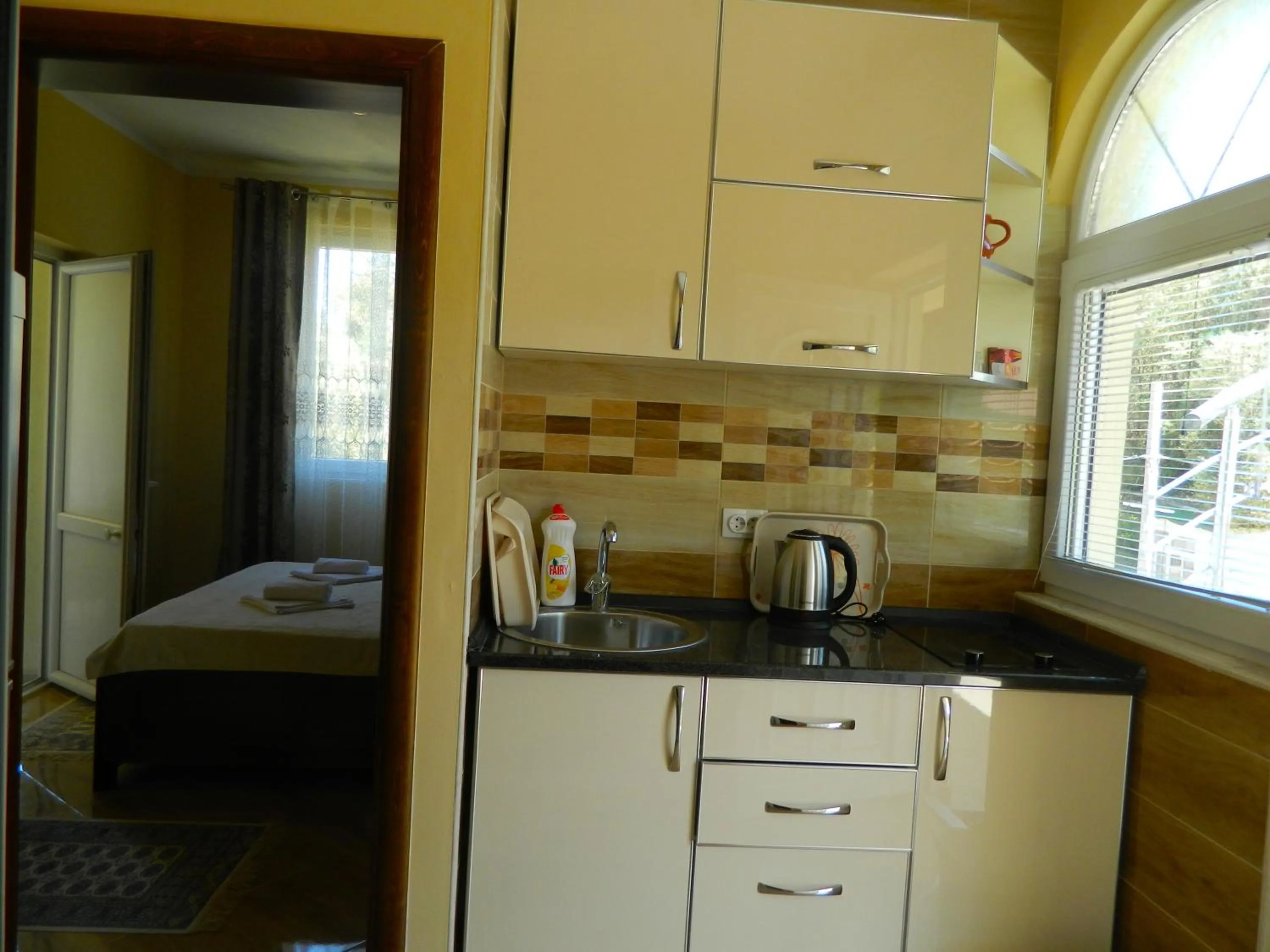 Kitchen or kitchenette in President Bungalows and Apartments