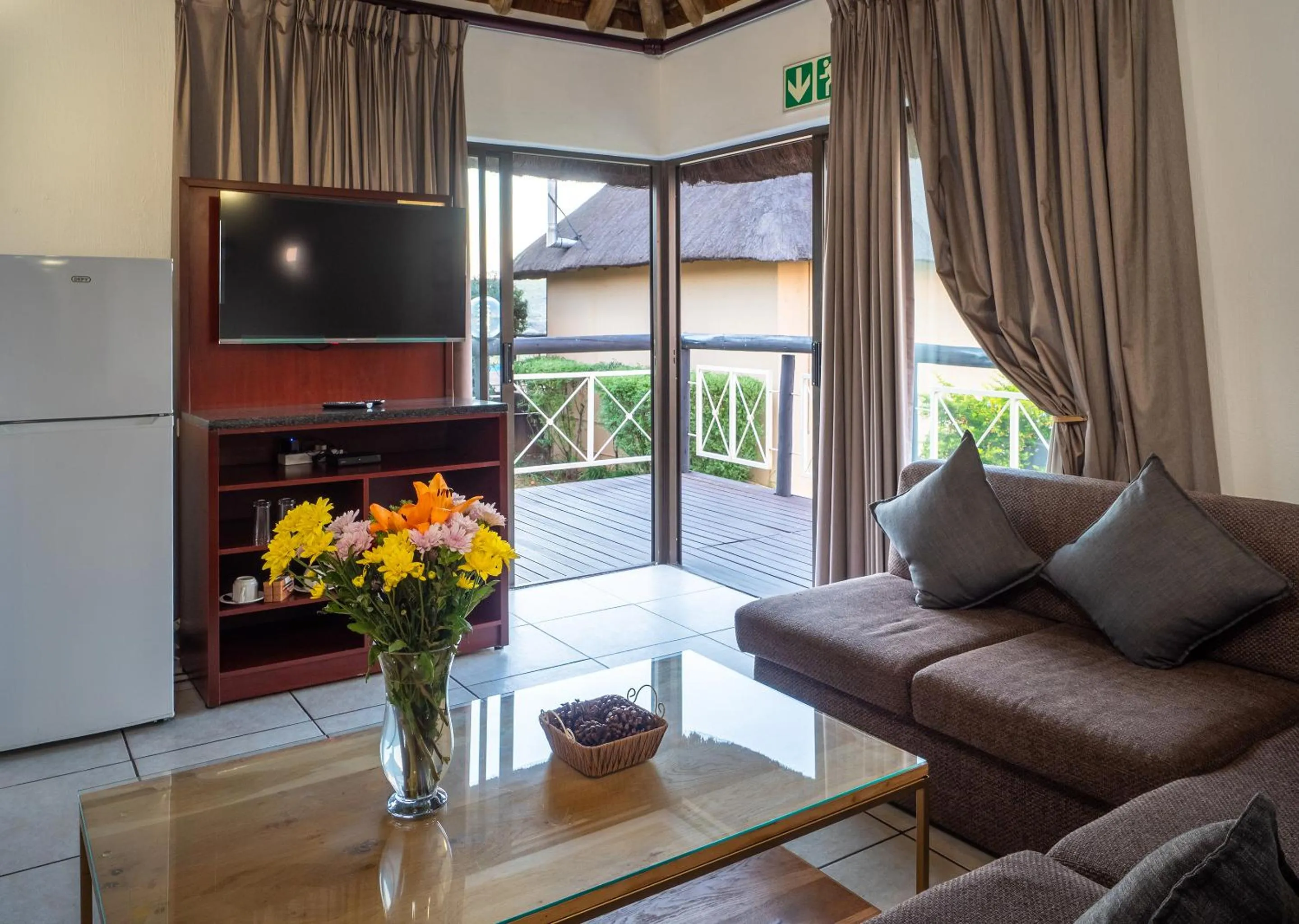 Communal lounge/ TV room in Mount Savannah Lodge by Dream Resorts