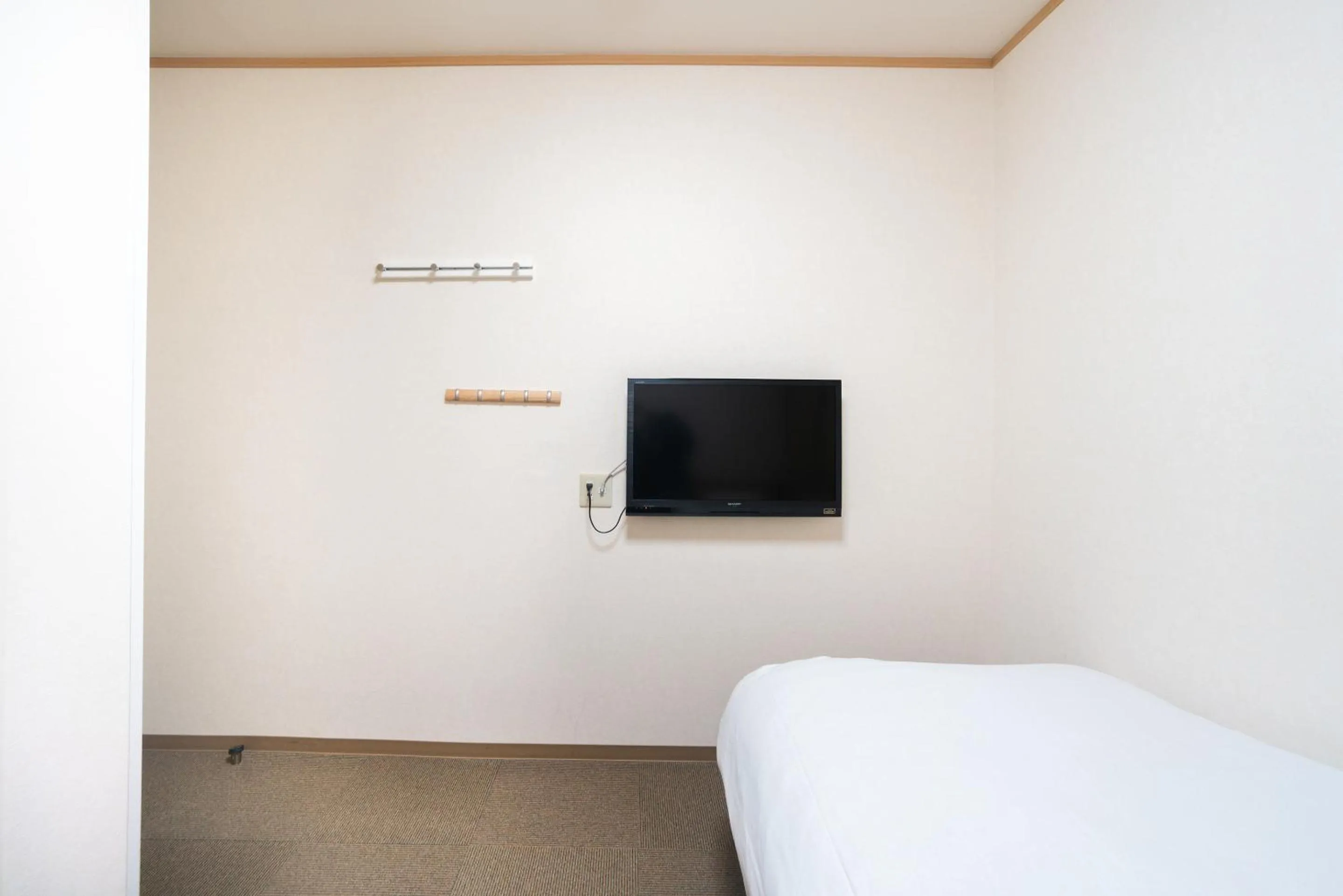 Bed in Tabist Hotel Daimu Minami-Souma