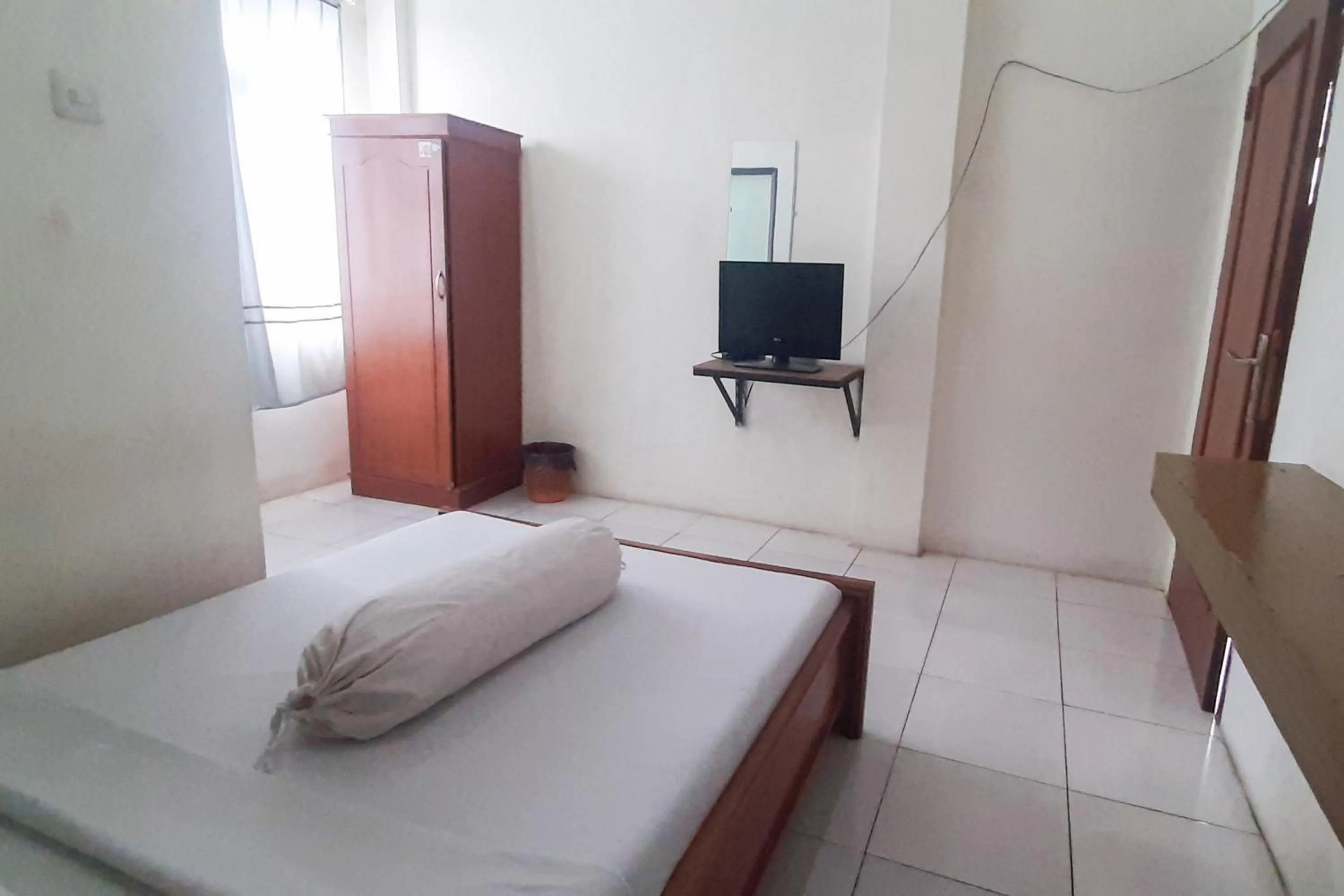 Bed in RedDoorz Syariah At Penginapan Sederhana Palembang