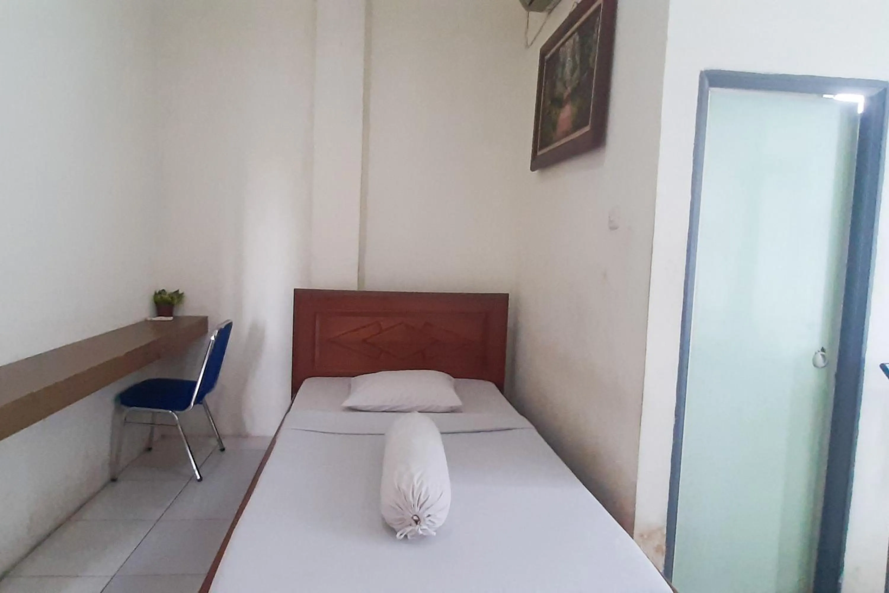 Bed in RedDoorz Syariah At Penginapan Sederhana Palembang