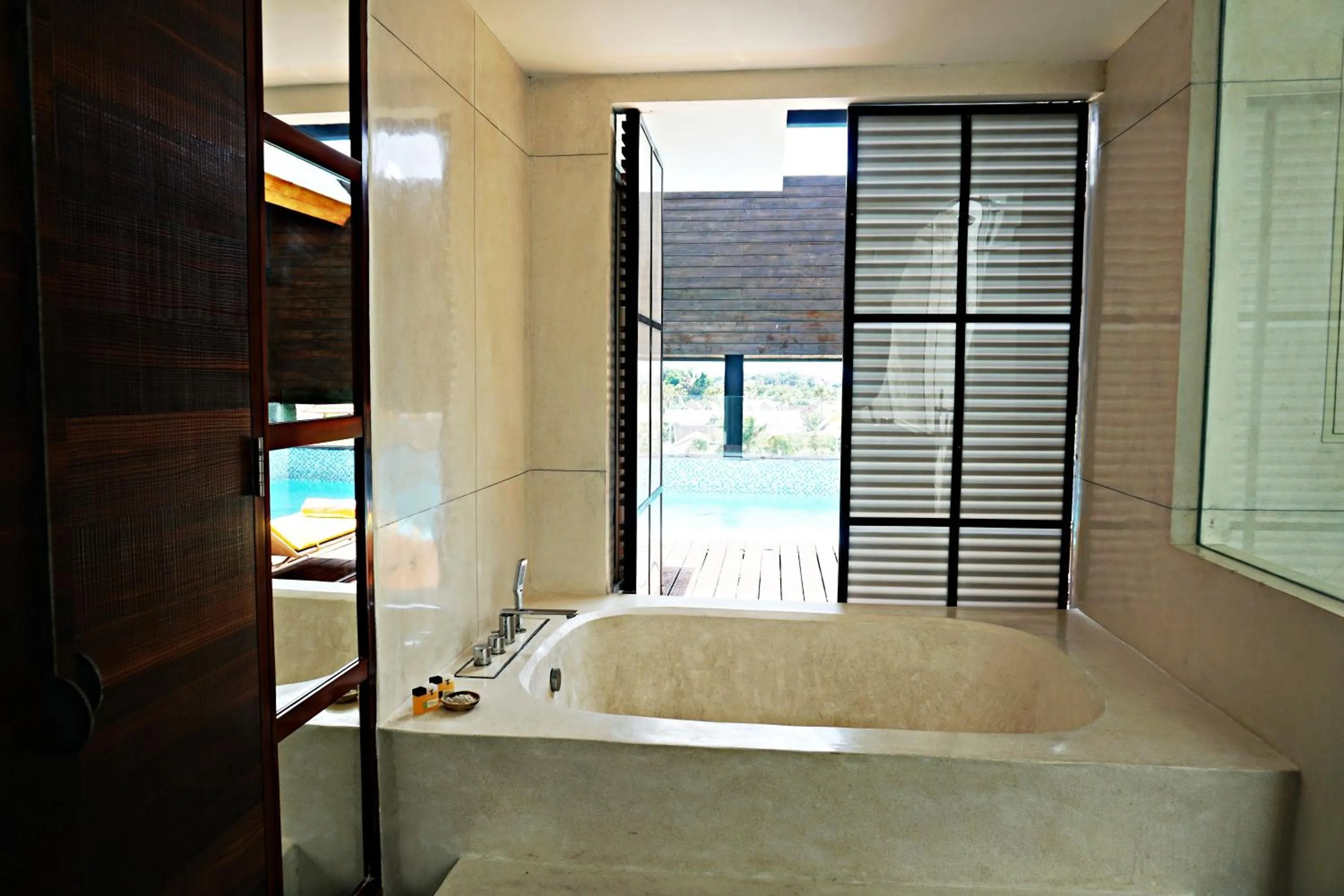 Bath, Bed in TS SUITES Seminyak Bali